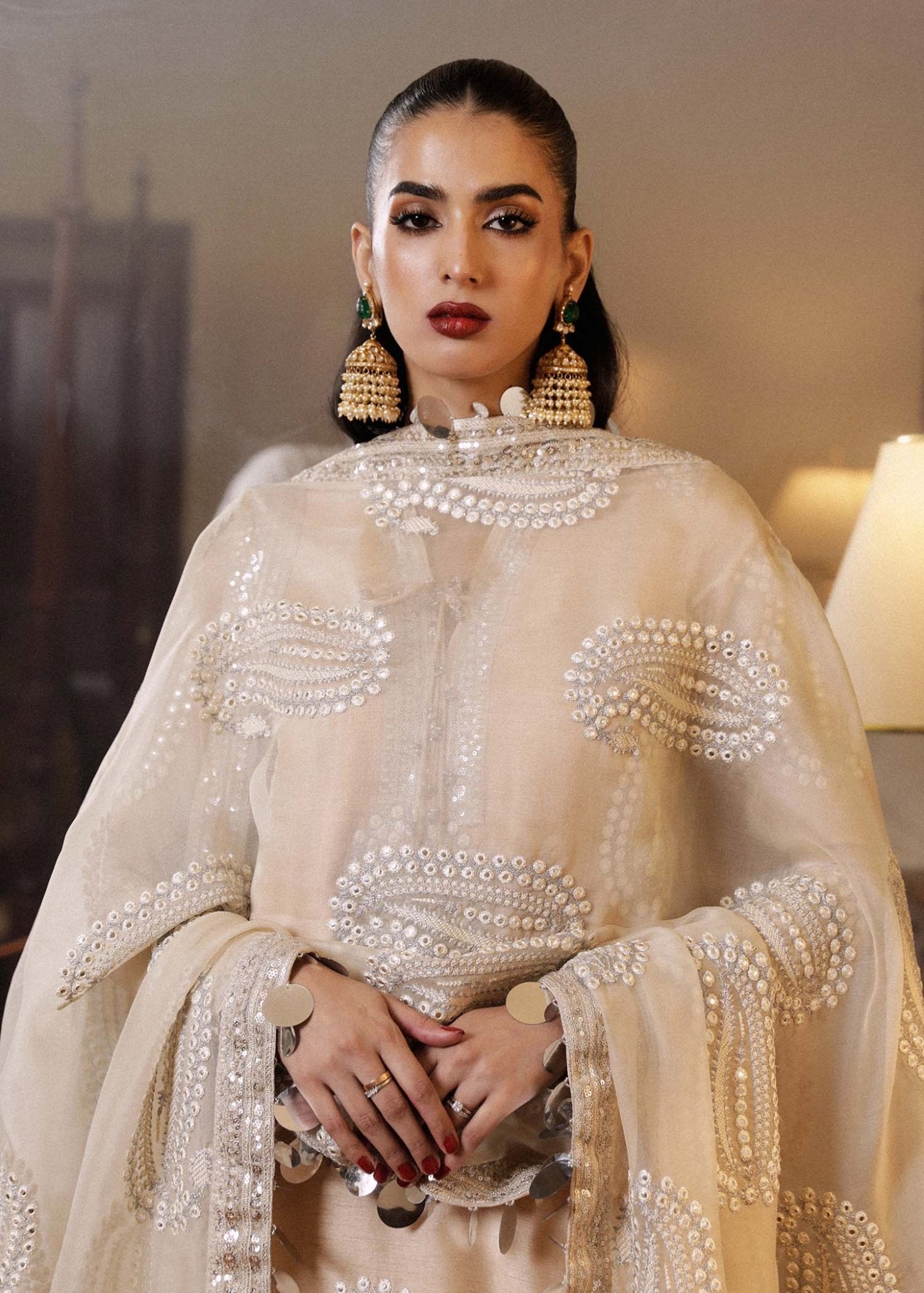 Model wearing a beige Moh dress from Hussain Rehar's Luxury Pret SS/24 collection. Pakistani clothes online in UK.