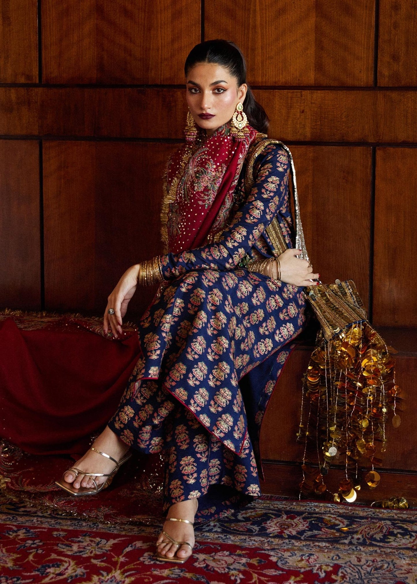 Model wearing a navy blue Pur dress from Hussain Rehar's Luxury Pret SS/24 collection. Pakistani clothes online in UK.