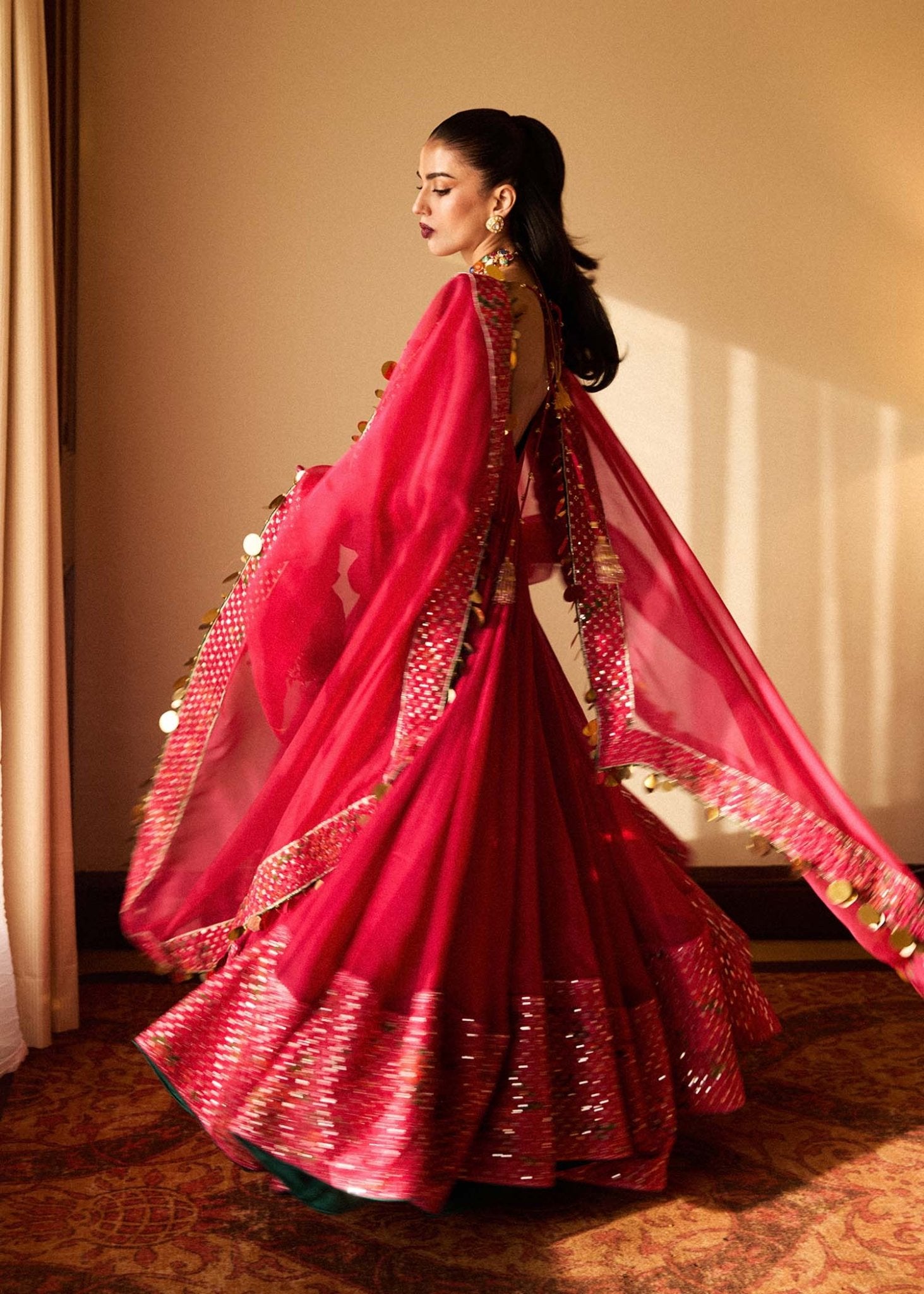 Model wearing a vibrant pink Roshan dress from Hussain Rehar's Luxury Pret SS/24 collection. Pakistani clothes online in UK.