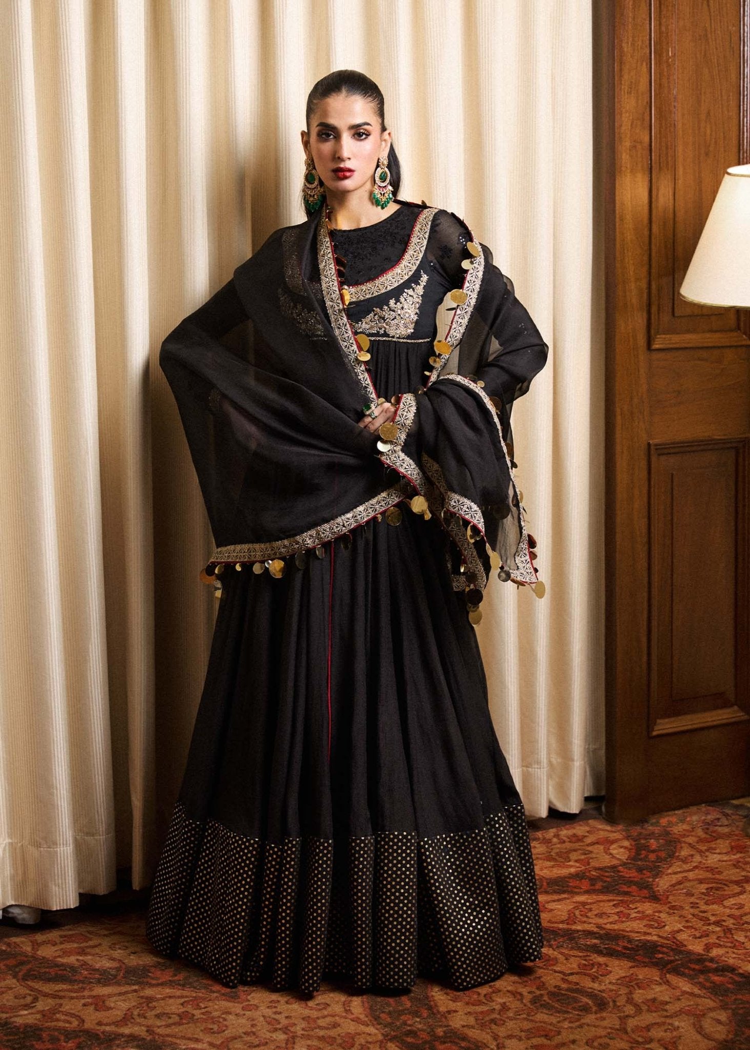 Model wearing a black Rubai dress from Hussain Rehar's Luxury Pret collection. Pakistani clothes online in UK.