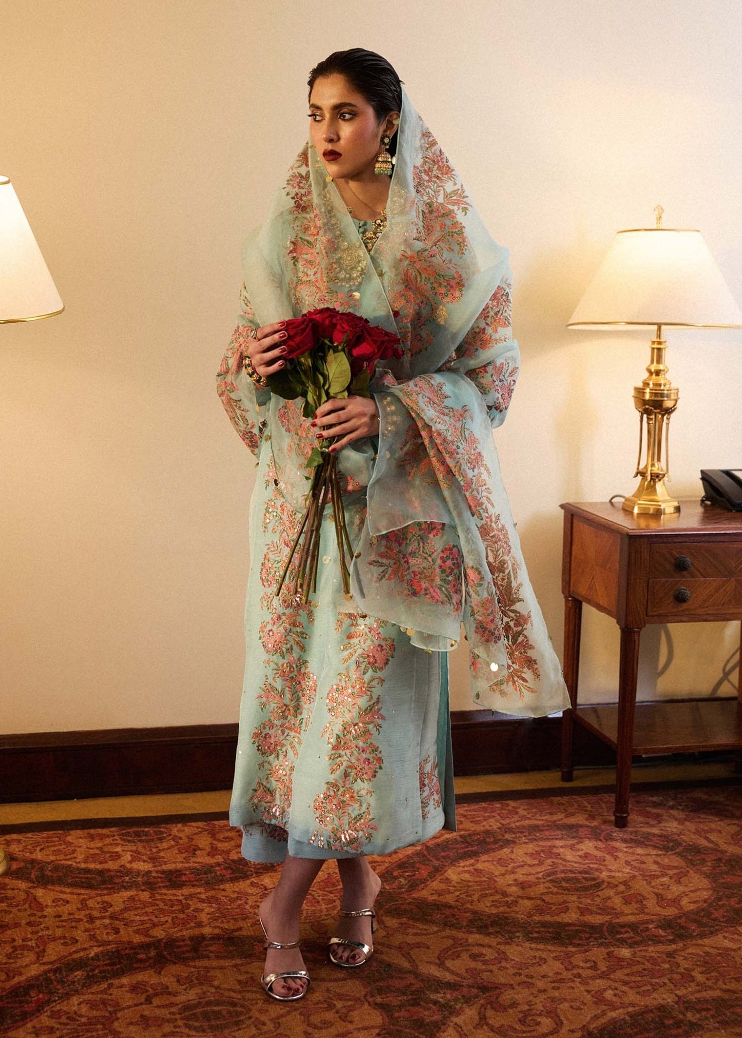 Model wearing a light blue Salji dress from Hussain Rehar's Luxury Pret SS/24 collection. Pakistani clothes online in UK.