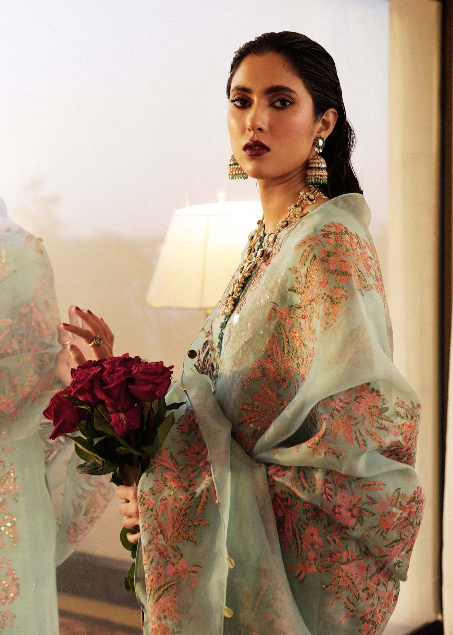 Model wearing a light blue Salji dress from Hussain Rehar's Luxury Pret SS/24 collection. Pakistani clothes online in UK.