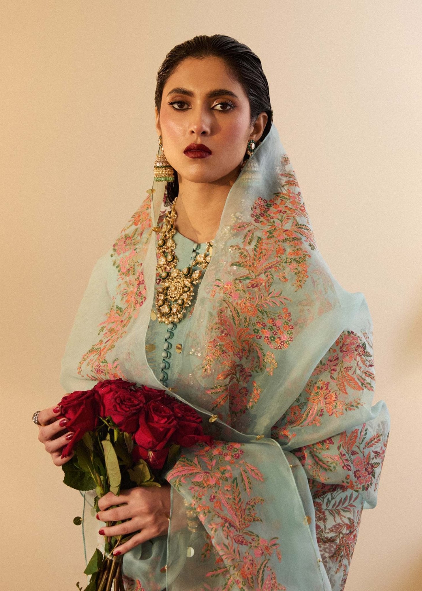 Model wearing a light blue Salji dress from Hussain Rehar's Luxury Pret SS/24 collection. Pakistani clothes online in UK.