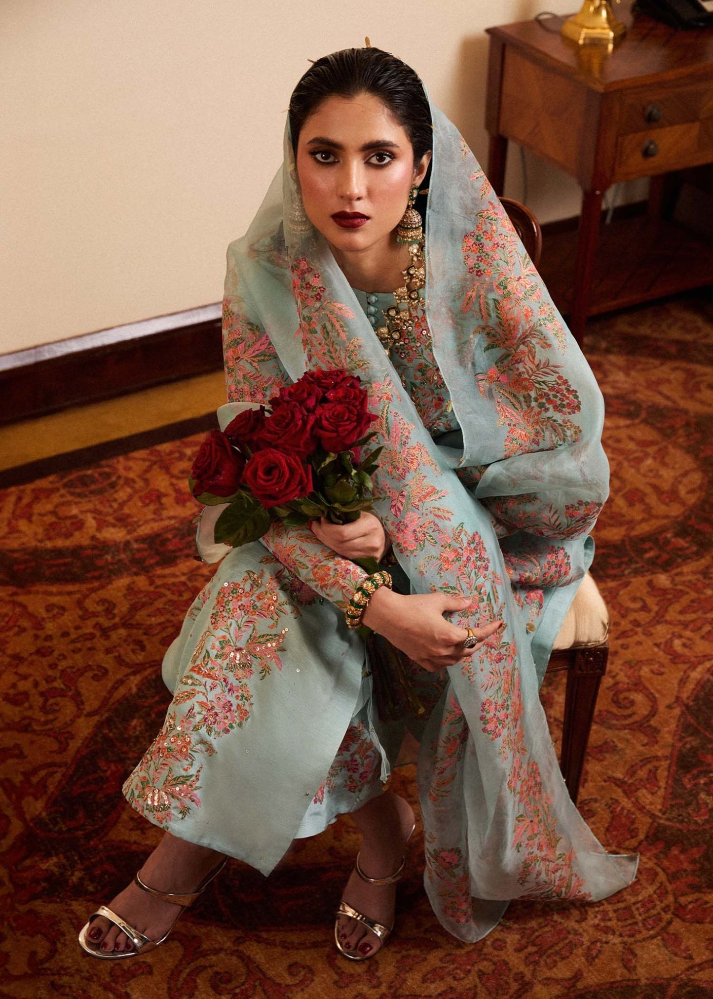 Model wearing a light blue Salji dress from Hussain Rehar's Luxury Pret SS/24 collection. Pakistani clothes online in UK.