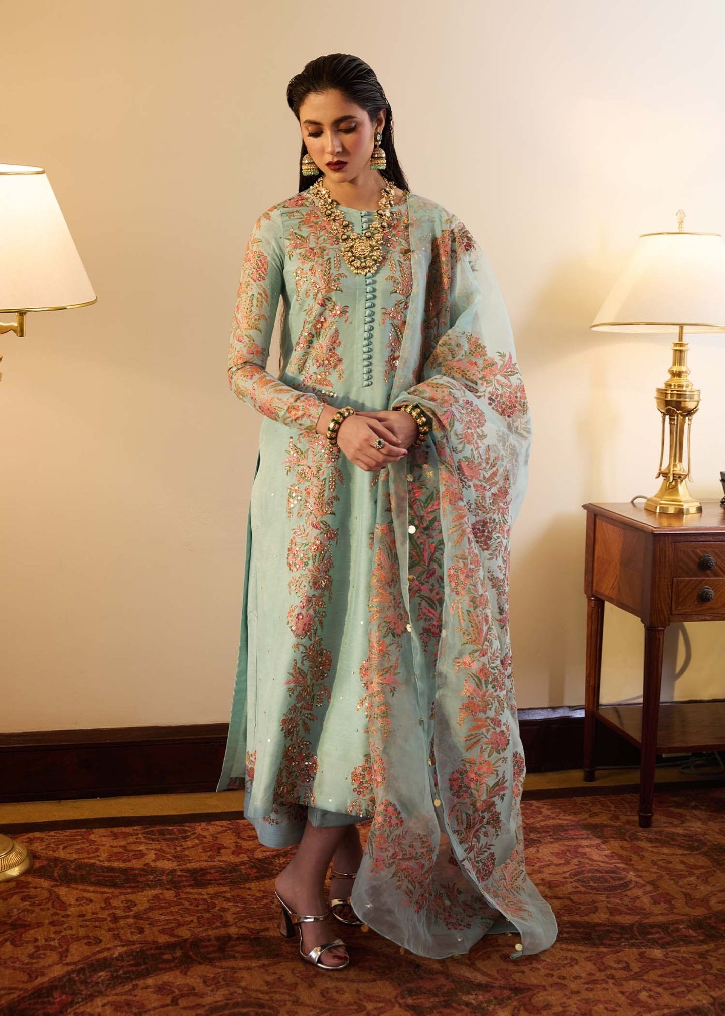 Model wearing a light blue Salji dress from Hussain Rehar's Luxury Pret SS/24 collection. Pakistani clothes online in UK.