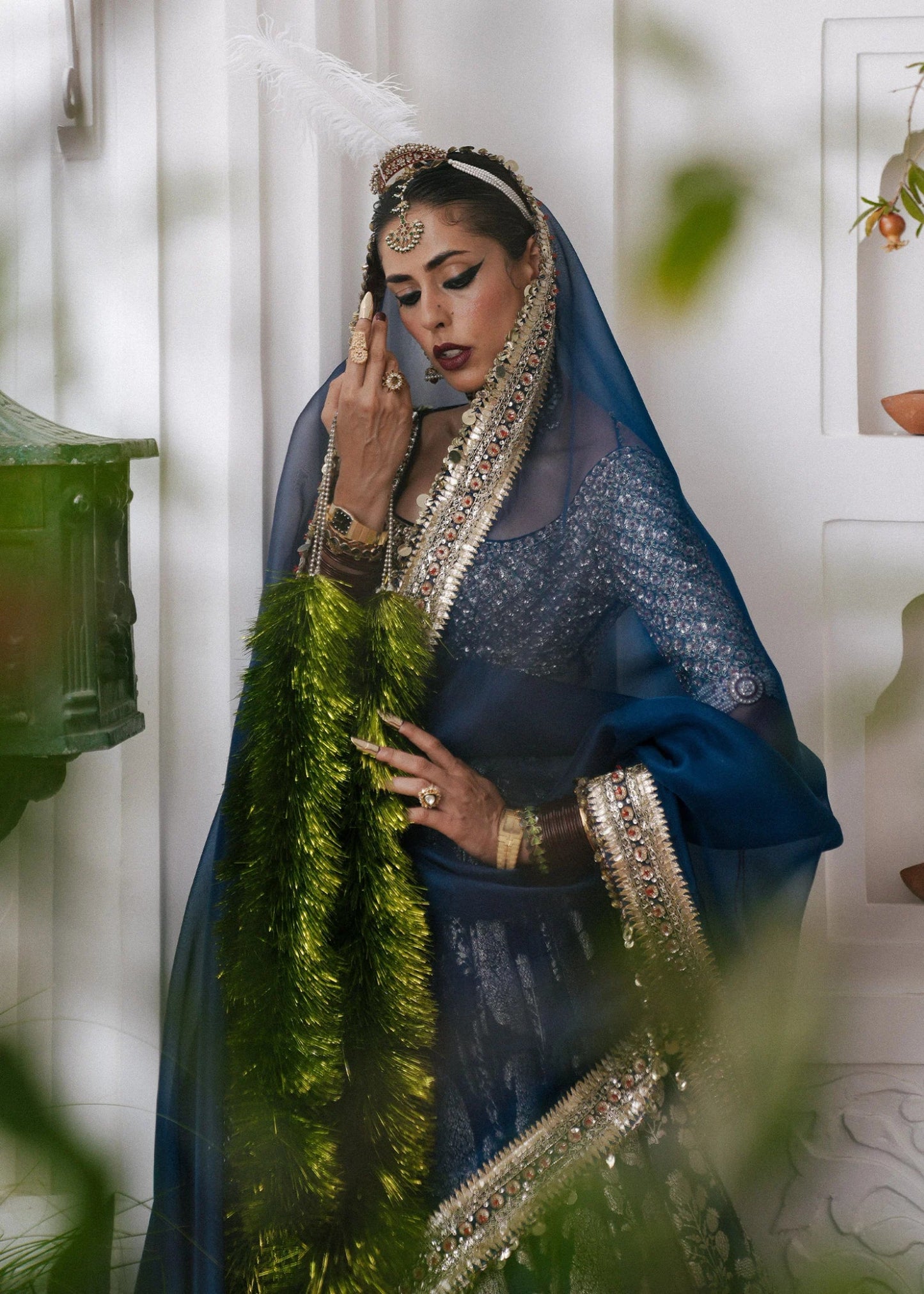 Hussain Rehar's Neelam lehenga, choli and duppatta from Rehar Nagar Bridals'24 in rich blue with intricate silver embroidery, perfect for luxury bridal wear. Available online in the UK, ideal for formal Pakistani bridal attire.