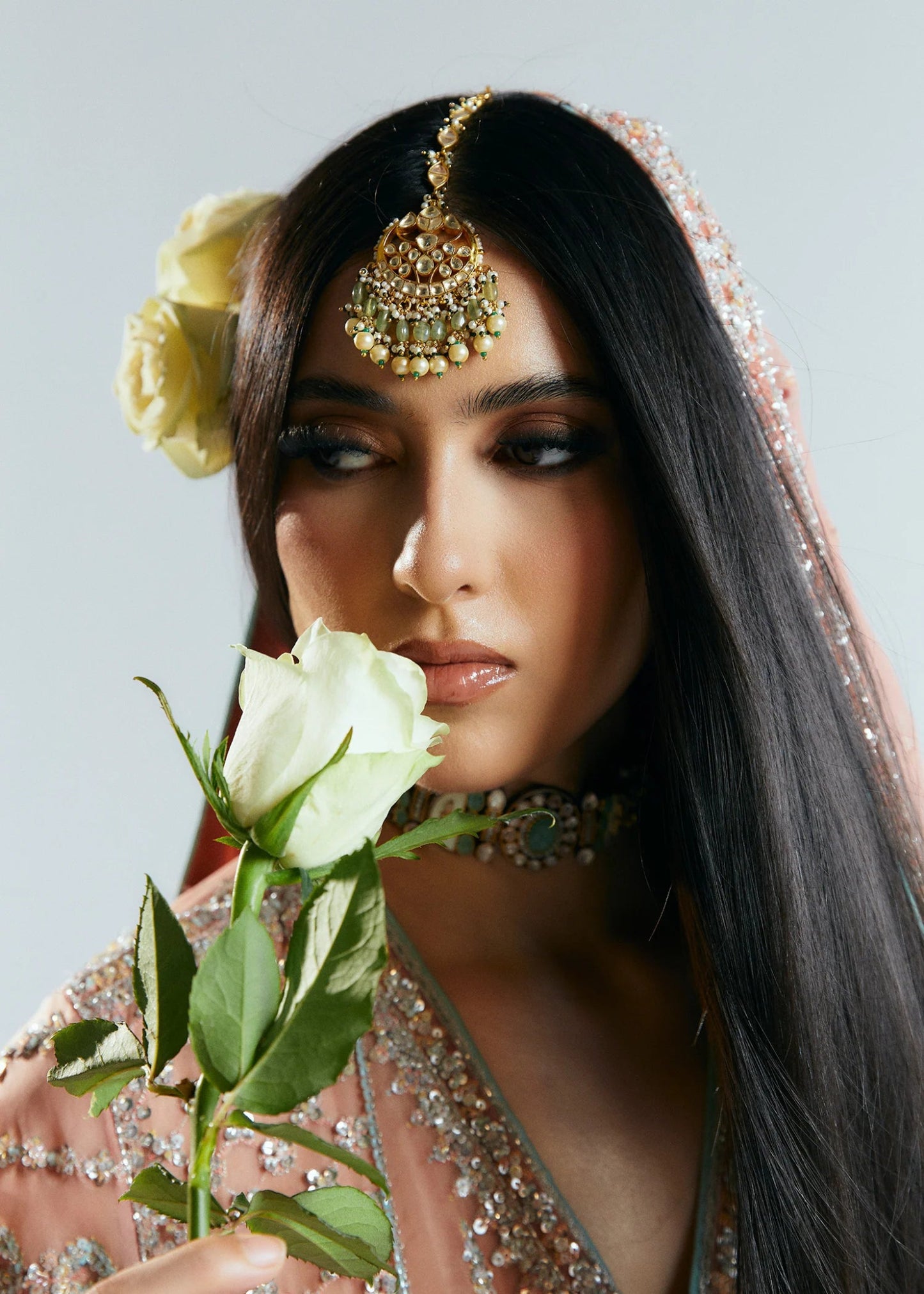 Model wearing a pink embellished Dusk dress from Hussain Rehar's Sitaray Formals collection. Perfect for Pakistani wedding clothes online in UK.