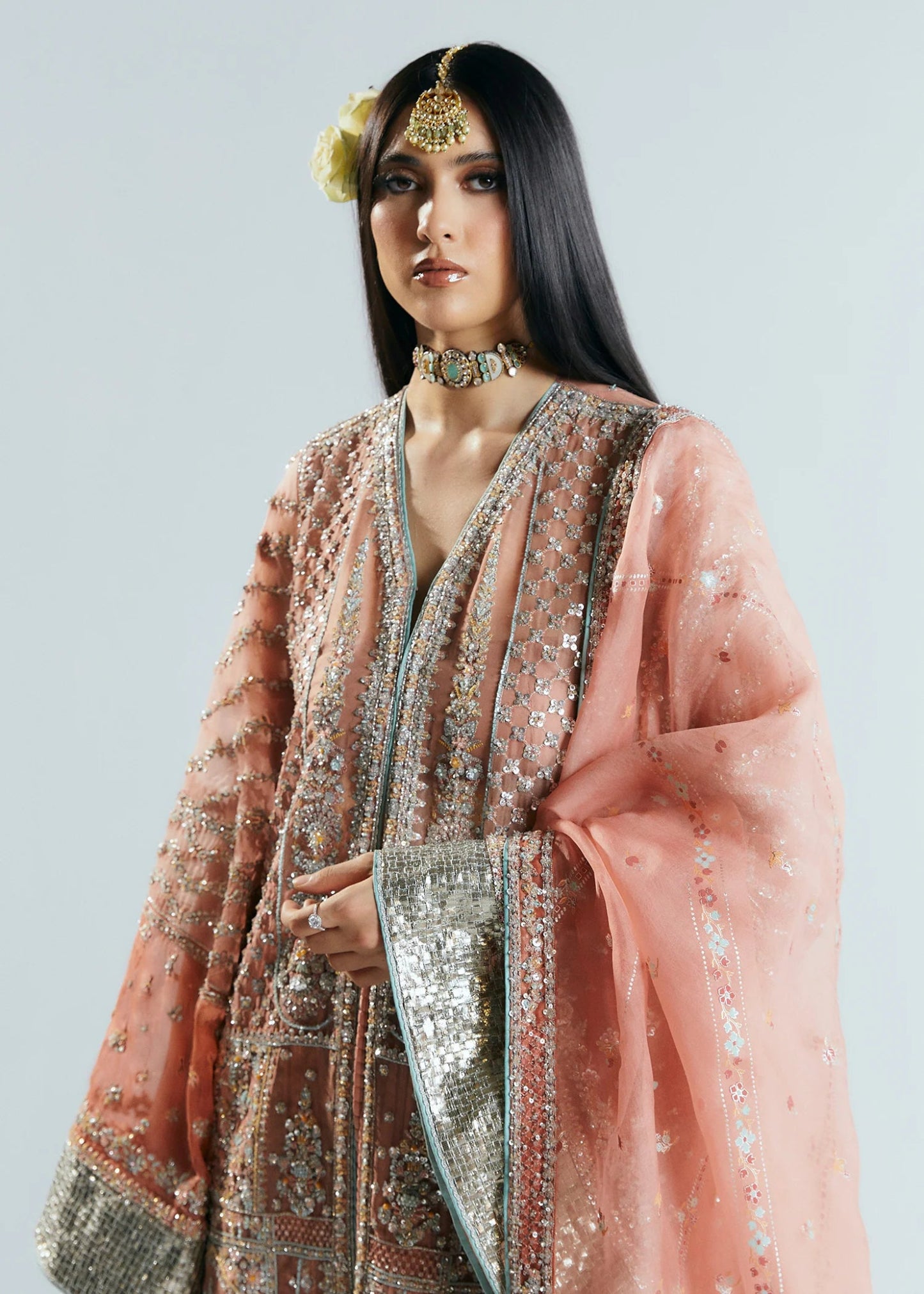 Model wearing a pink embellished Dusk dress from Hussain Rehar's Sitaray Formals collection. Perfect for Pakistani wedding clothes online in UK.