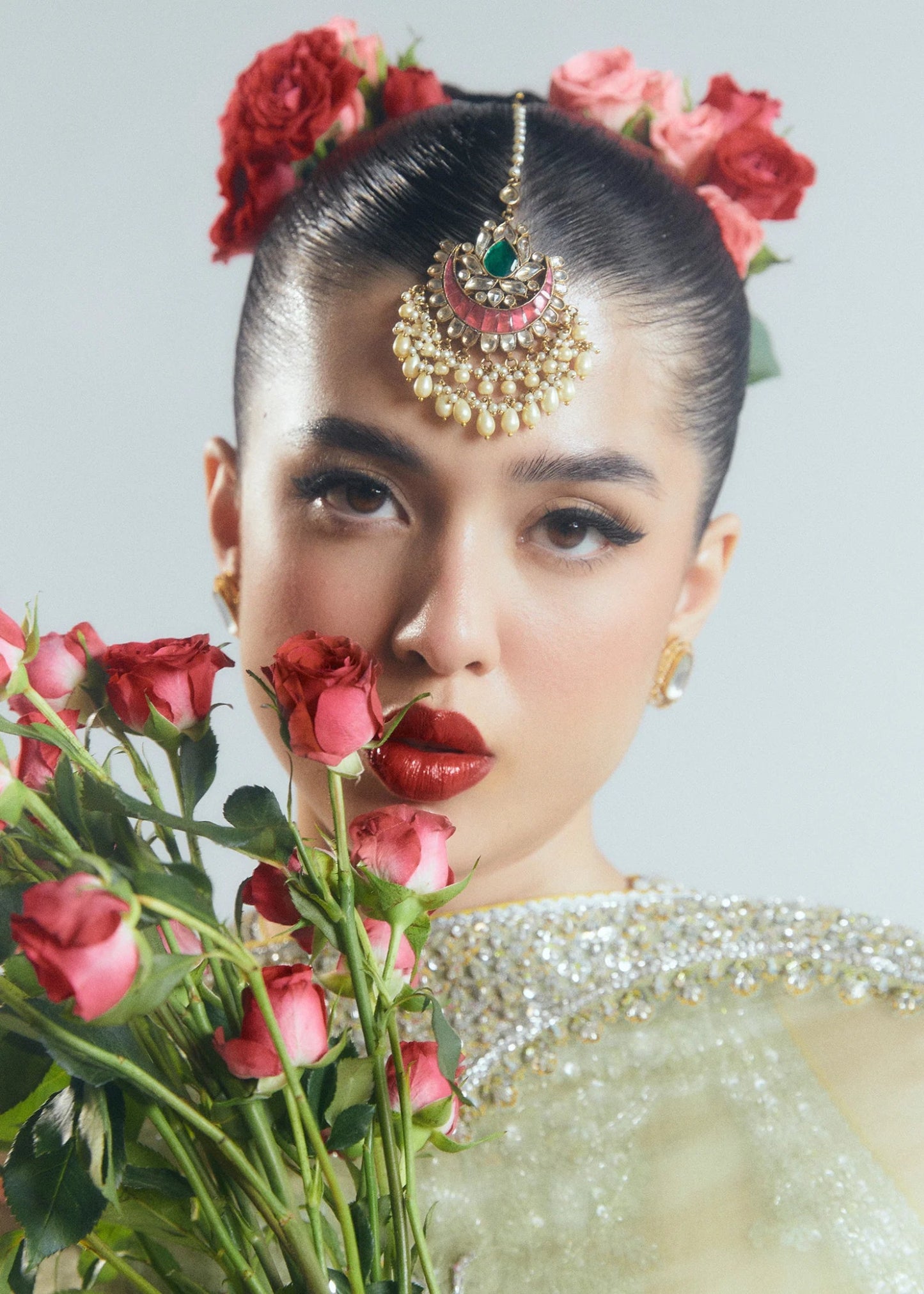 Model wearing a pastel green Mintara dress by Hussain Rehar, featuring intricate silver embroidery, perfect for weddings. Pakistani clothes online UK.