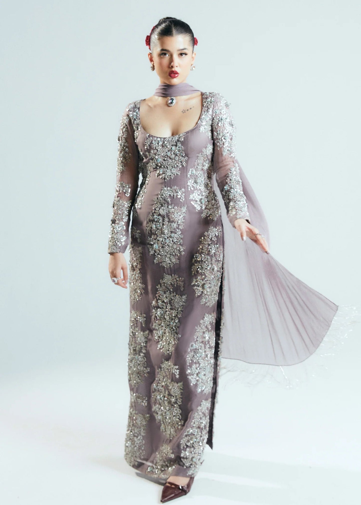 Model wearing a shimmering, mauve - colored Mystic dress from Hussain Rehar's Sitaray Formals collection.