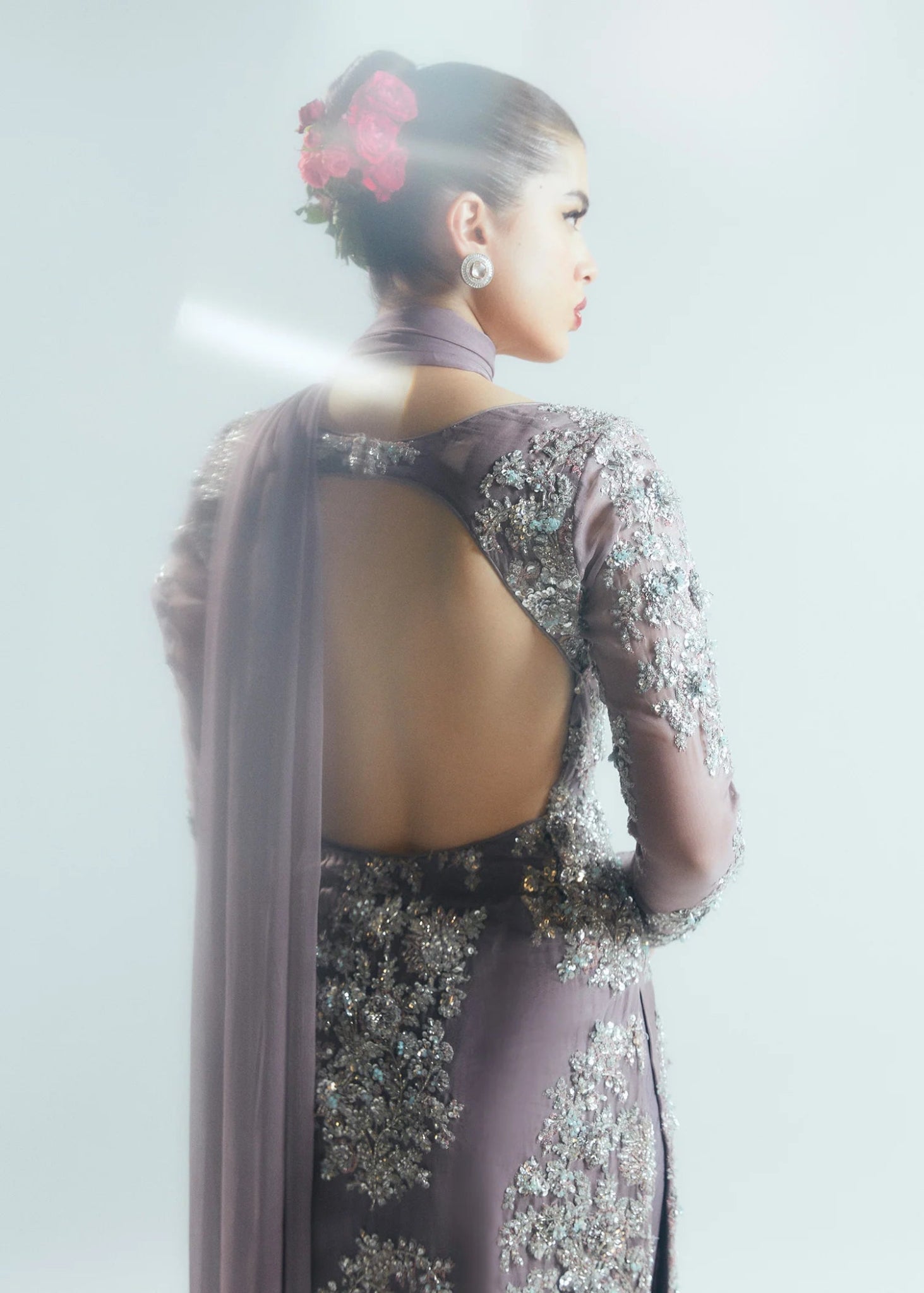 Model wearing a shimmering, mauve - colored Mystic dress from Hussain Rehar's Sitaray Formals collection.