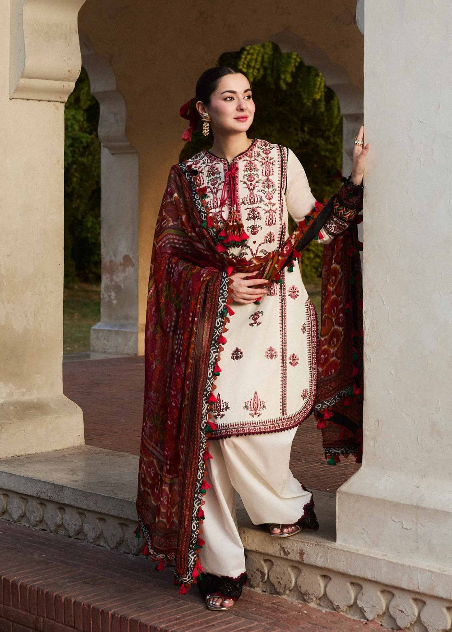 Model wearing a cream Fawn dress from Hussain Rehar's SS Lawn 24 collection. Pakistani clothes online in UK.