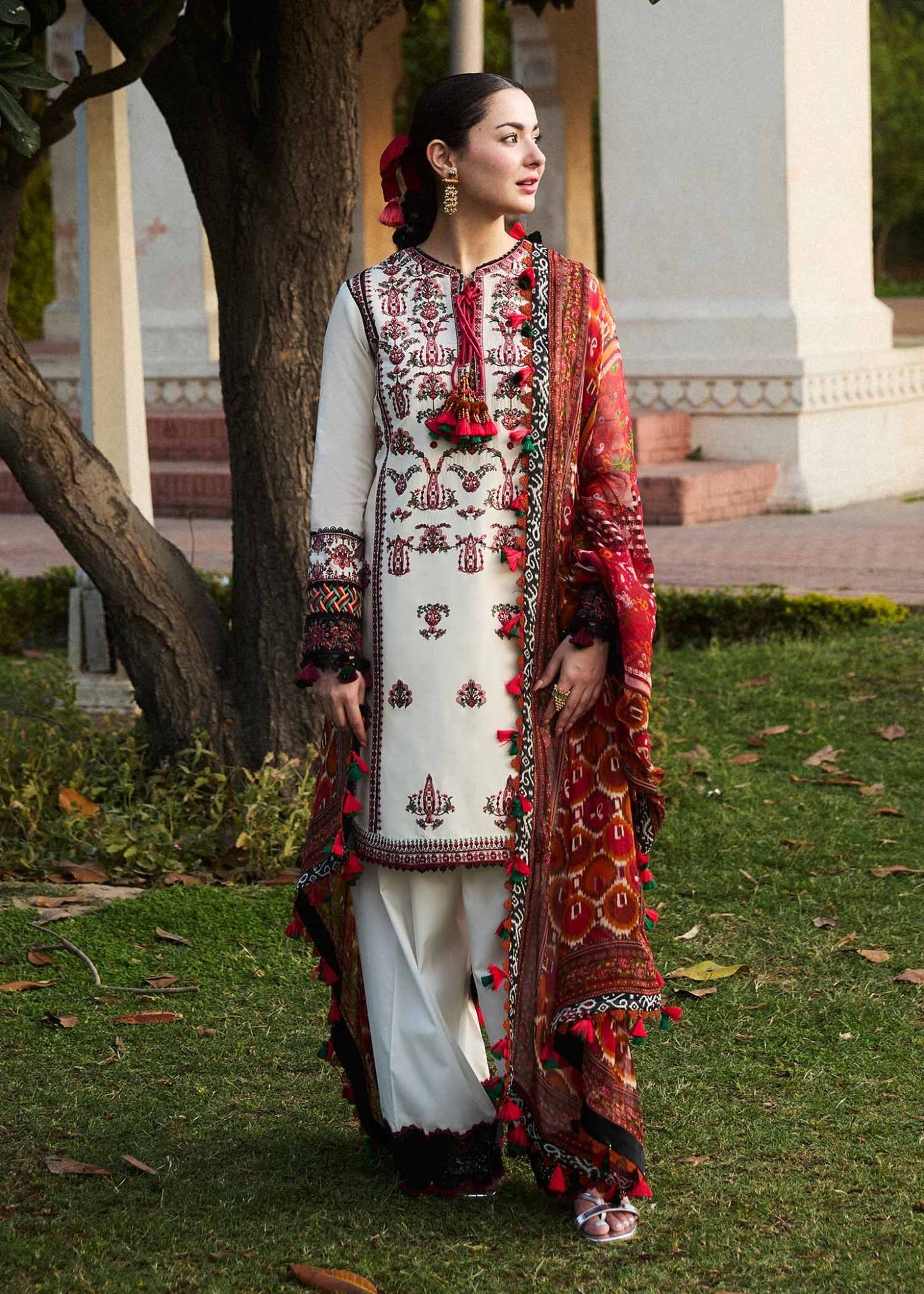 Model wearing Hussain Rehar Fawn dress, featuring intricate red embroidery, ideal for Pakistani designer clothes in the UK.