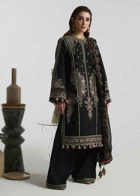 Model wearing a black Aurora dress from Hussain Rehar's SS Lawn Eid Collection '24. Pakistani clothes online in UK.