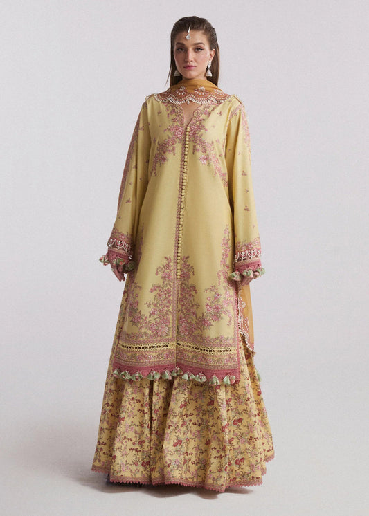 Model wearing a light yellow Limone dress from Hussain Rehar's SS Lawn Eid Collection '24. Pakistani clothes online in UK.