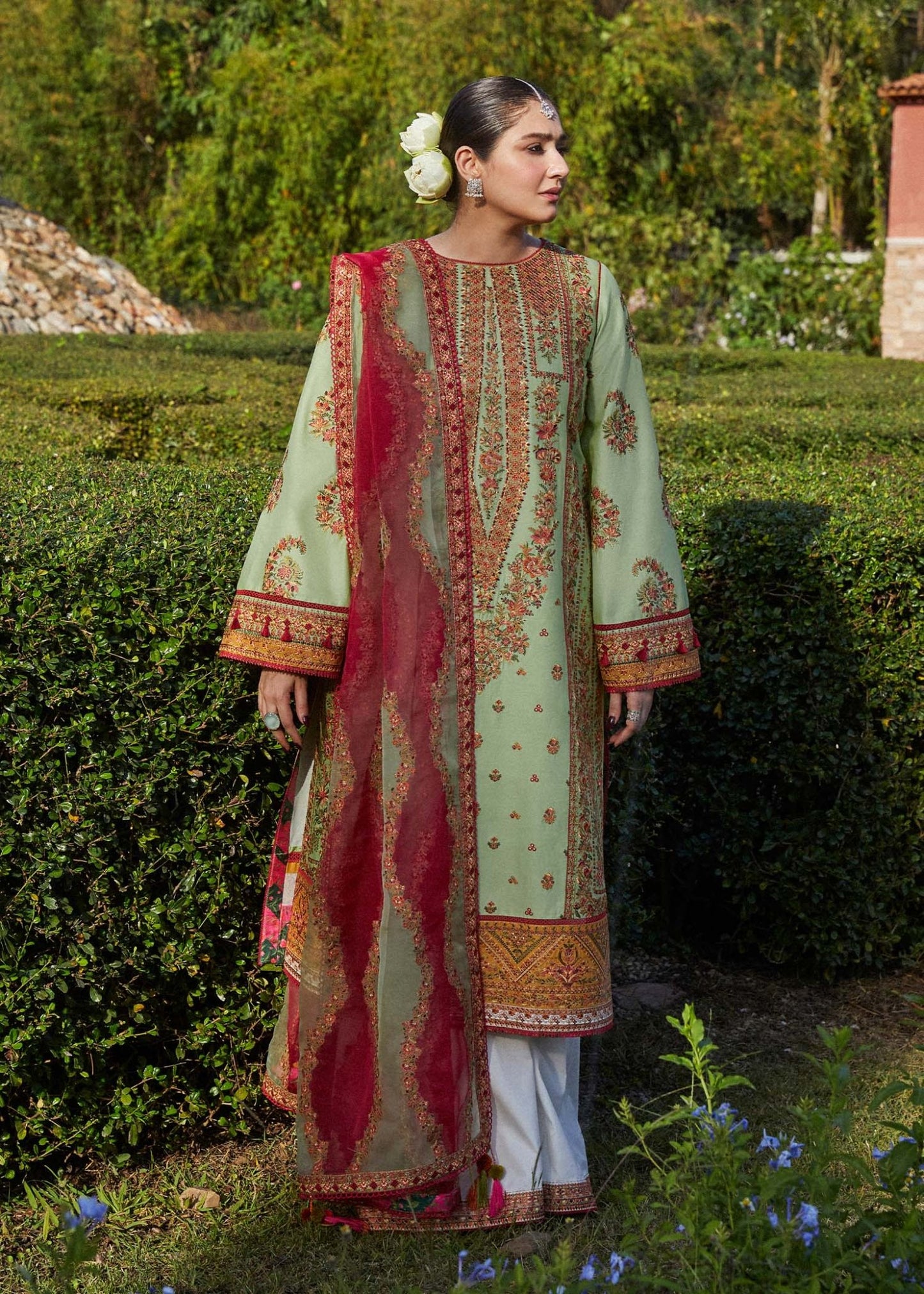 Model wearing light green Gul Bahar dress from Hussain Rehar's Zaiba Lawn '24 collection. Pakistani clothes online in UK. Beautiful floral embroidery.