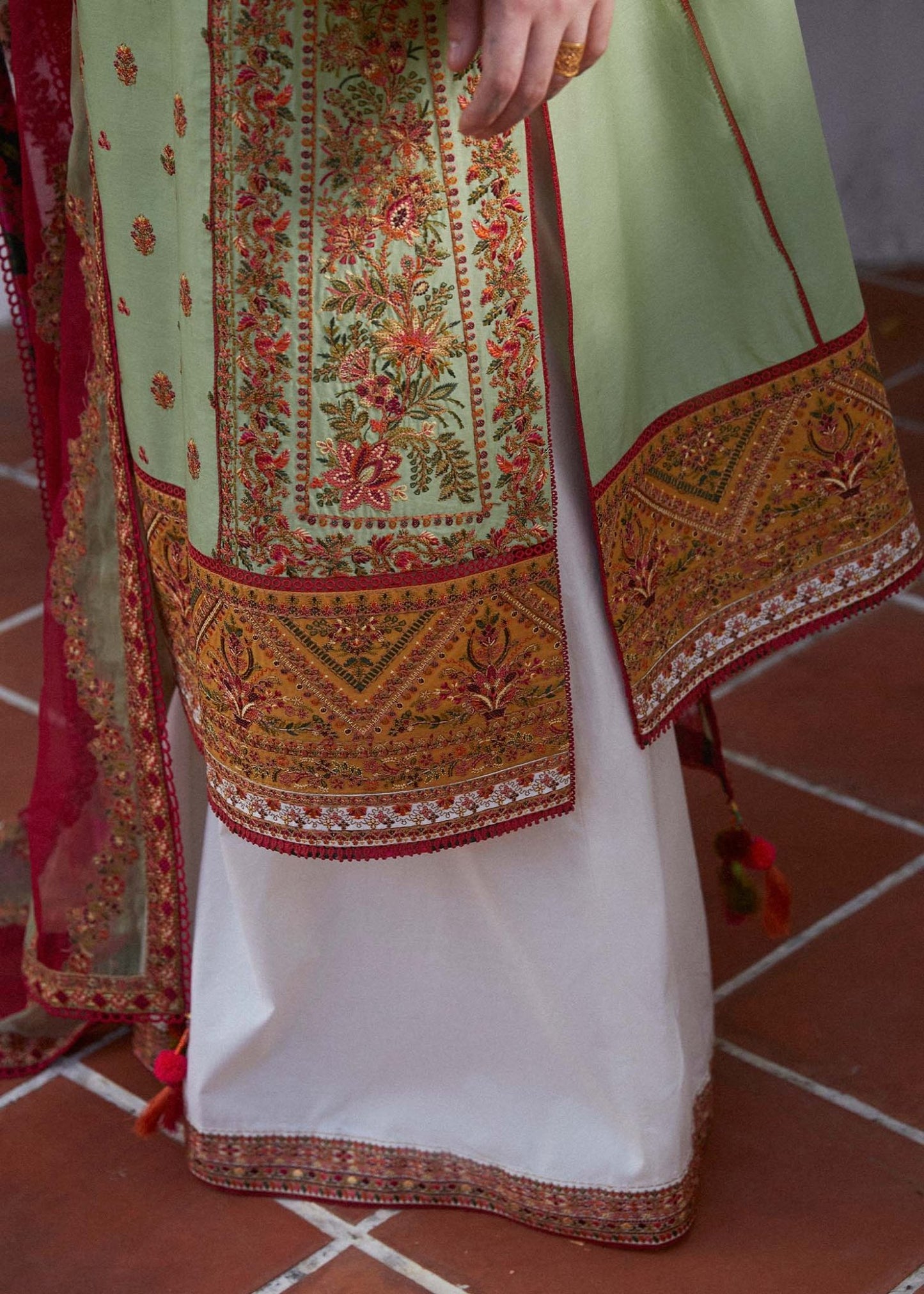 Model wearing light green Gul Bahar dress from Hussain Rehar's Zaiba Lawn '24 collection. Pakistani clothes online in UK. Beautiful floral embroidery.