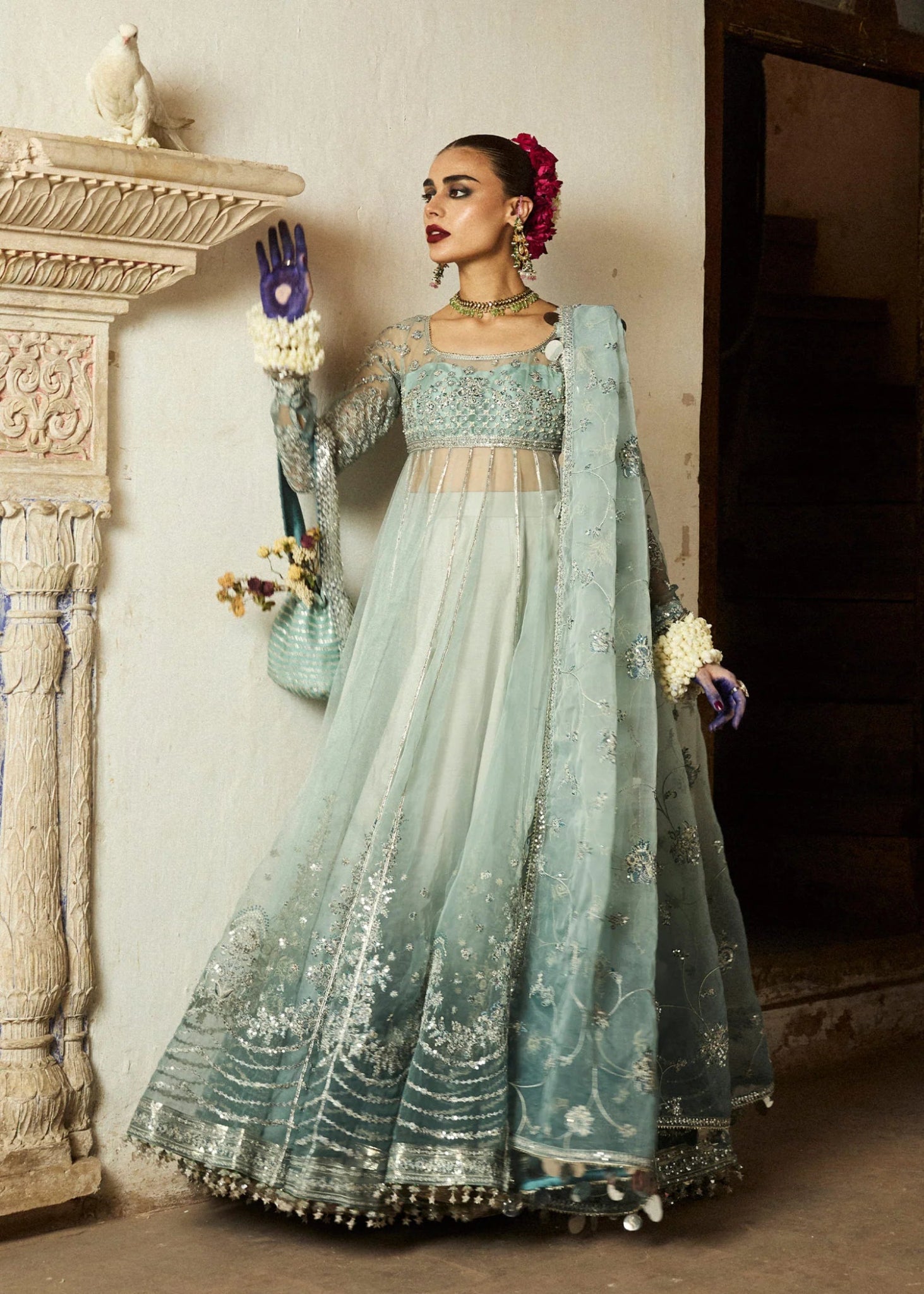 Model wearing a soft blue Maa’iya dress from Hussain Rehar's Wedding Festive Sep '24 Collection, featuring intricate embellishments. Pakistani wedding clothes available online in the UK.