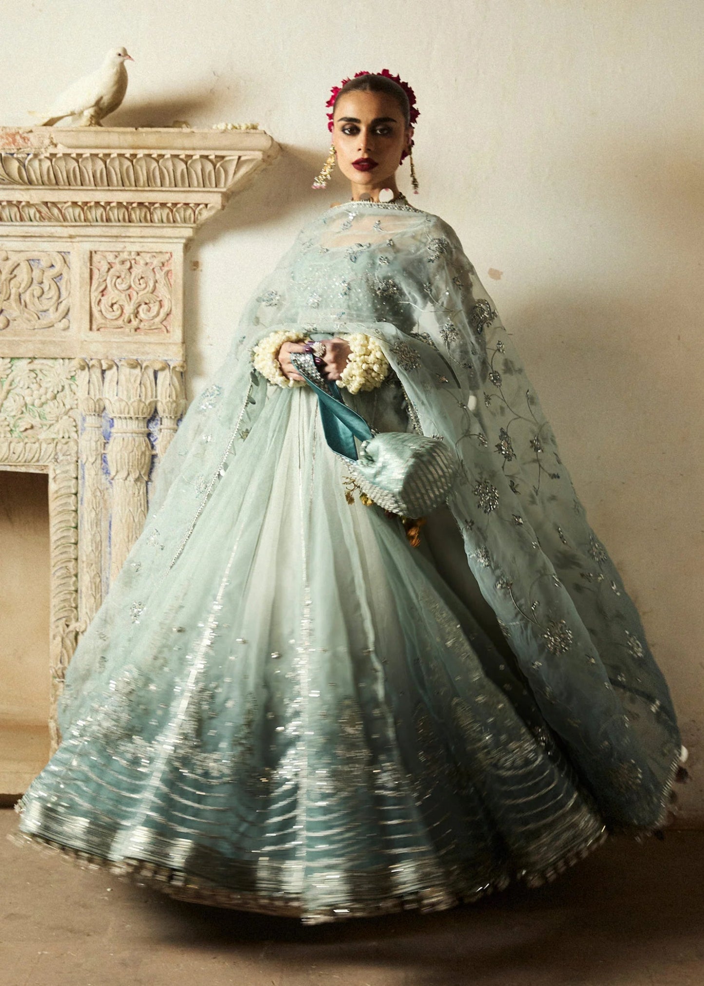 Model wearing a soft blue Maa’iya dress from Hussain Rehar's Wedding Festive Sep '24 Collection, featuring intricate embellishments. Pakistani wedding clothes available online in the UK.