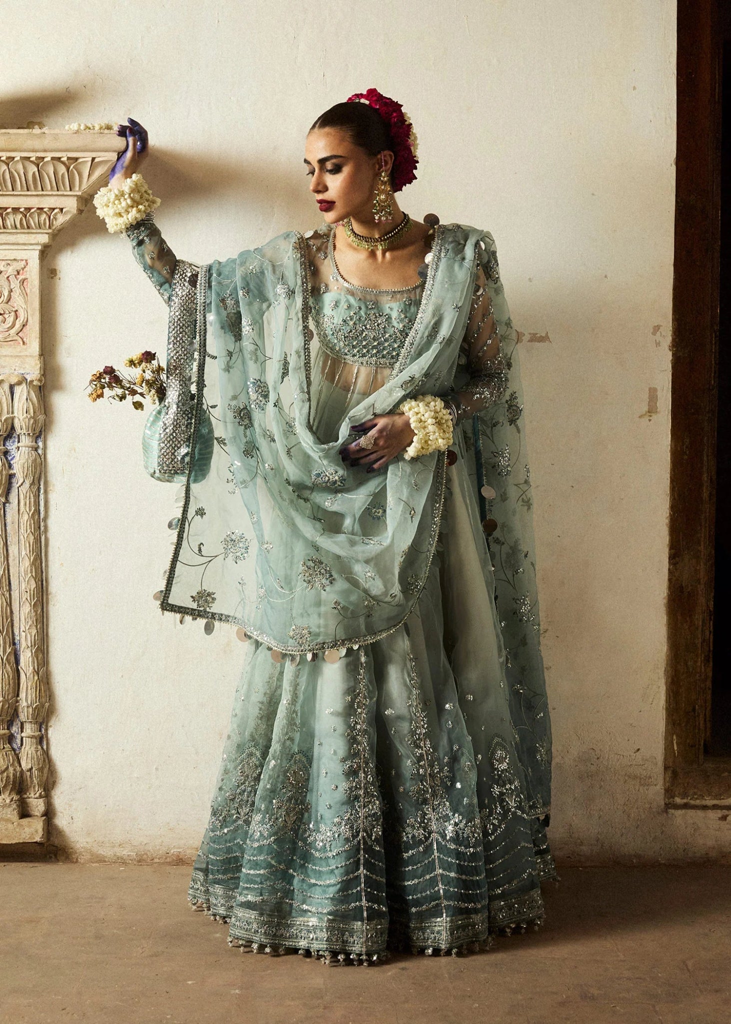 Model wearing a soft blue Maa’iya dress from Hussain Rehar's Wedding Festive Sep '24 Collection, featuring intricate embellishments. Pakistani wedding clothes available online in the UK.