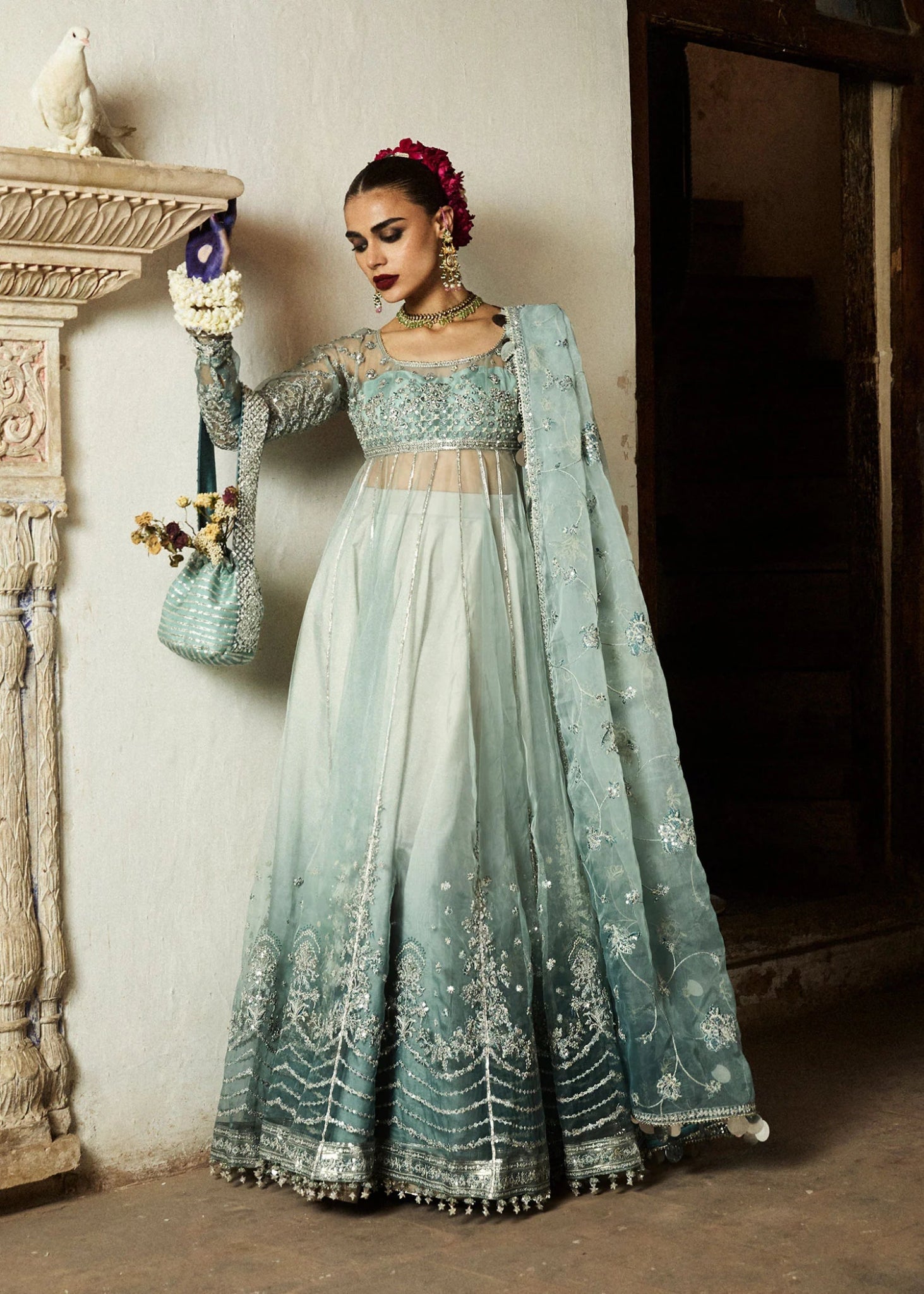 Model wearing a soft blue Maa’iya dress from Hussain Rehar's Wedding Festive Sep '24 Collection, featuring intricate embellishments. Pakistani wedding clothes available online in the UK.