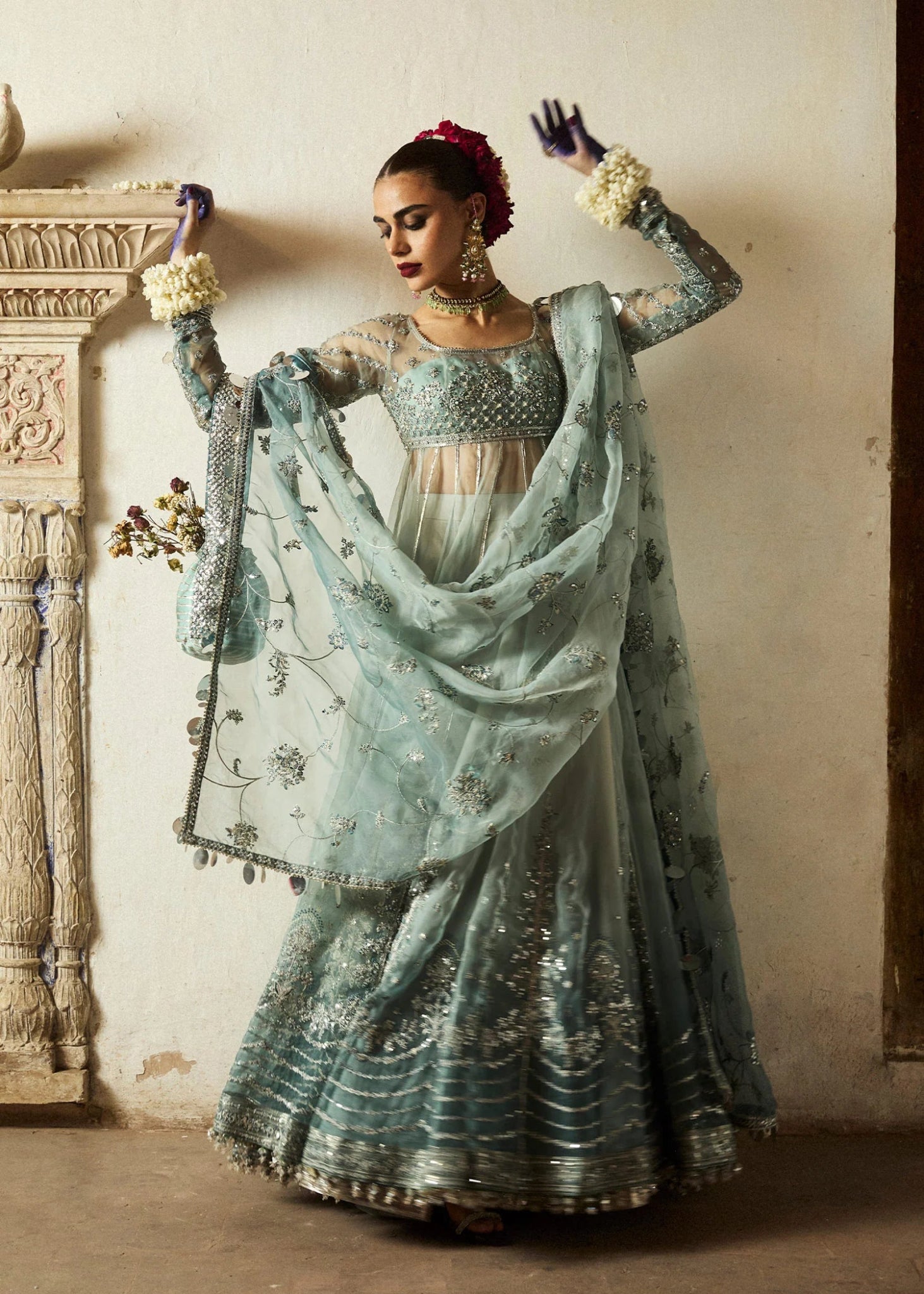 Model wearing a soft blue Maa’iya dress from Hussain Rehar's Wedding Festive Sep '24 Collection, featuring intricate embellishments. Pakistani wedding clothes available online in the UK.