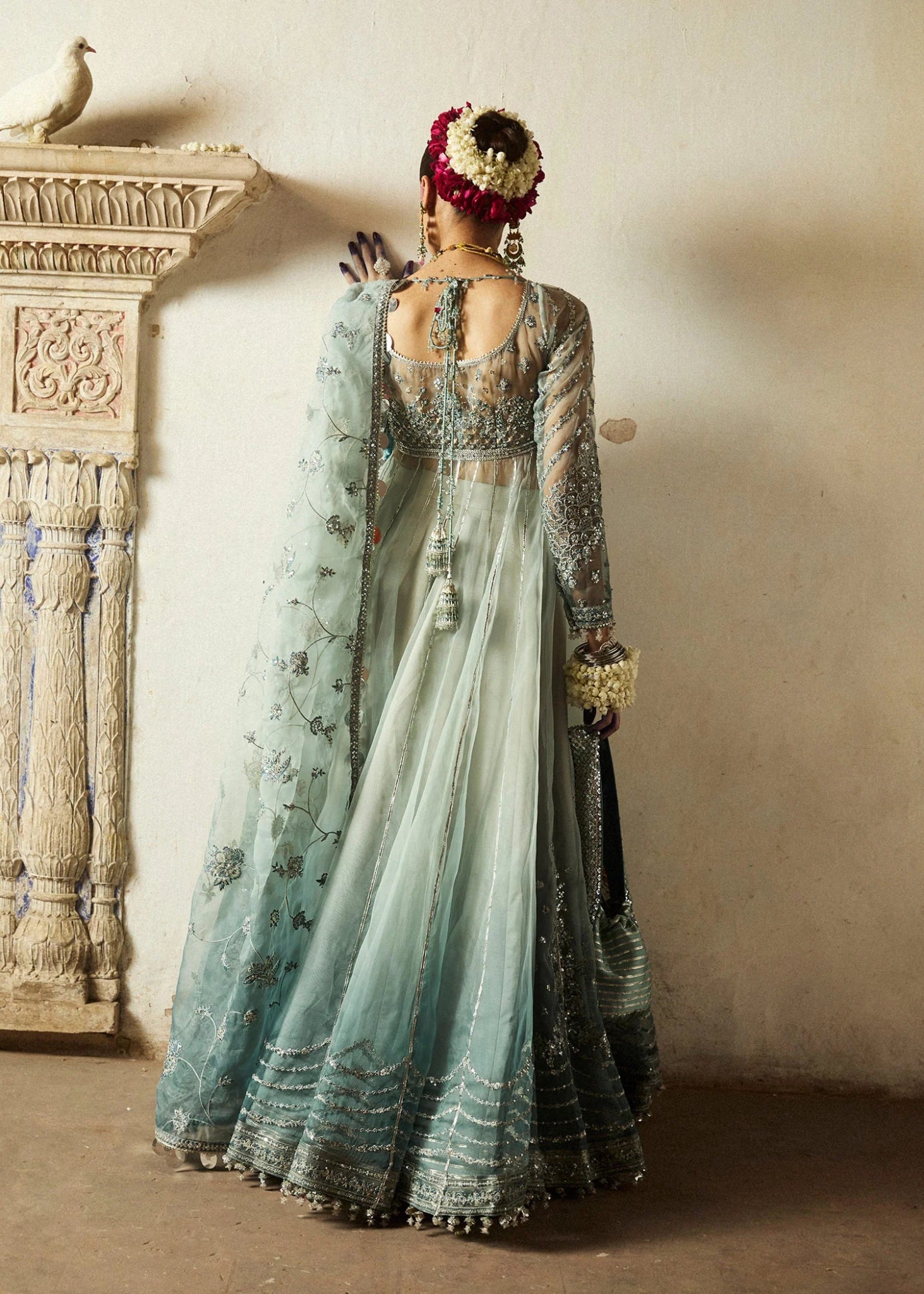 Model wearing a soft blue Maa’iya dress from Hussain Rehar's Wedding Festive Sep '24 Collection, featuring intricate embellishments. Pakistani wedding clothes available online in the UK.