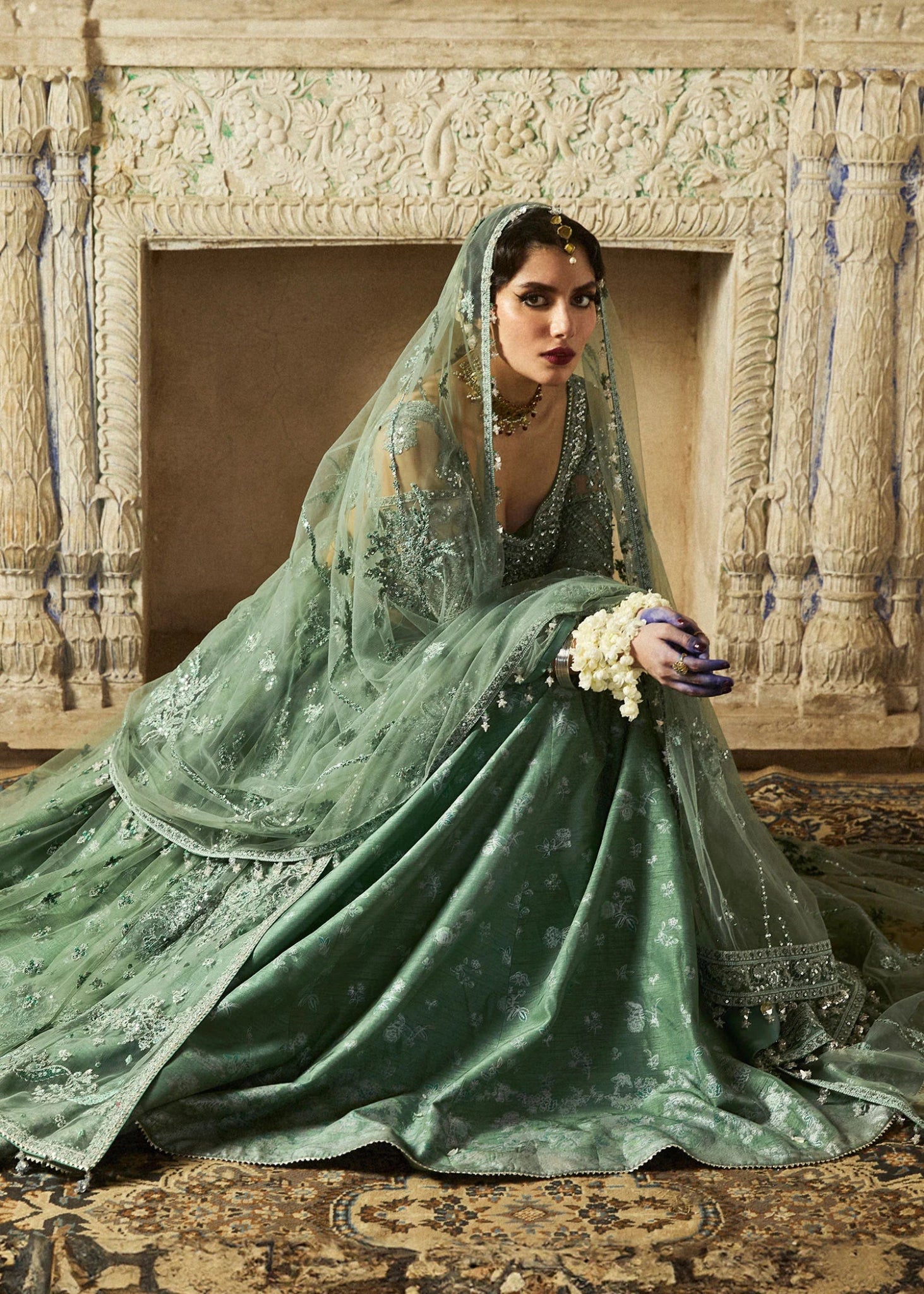 Model wearing a sage green Parag dress from Hussain Rehar's Wedding Festive Sep '24 Collection, featuring intricate embellishments. Pakistani wedding clothes available online in the UK.