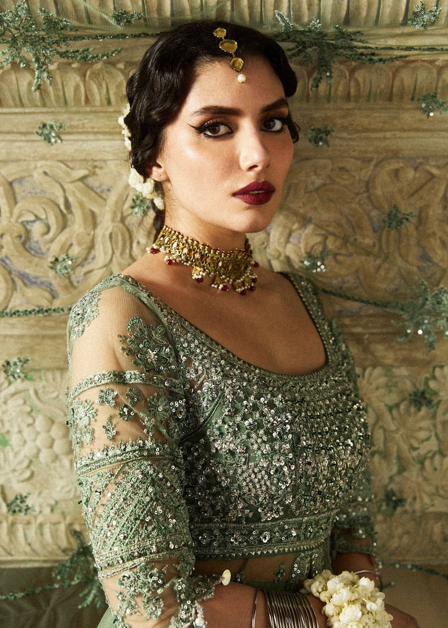 Model wearing a sage green Parag dress from Hussain Rehar's Wedding Festive Sep '24 Collection, featuring intricate embellishments. Pakistani wedding clothes available online in the UK.