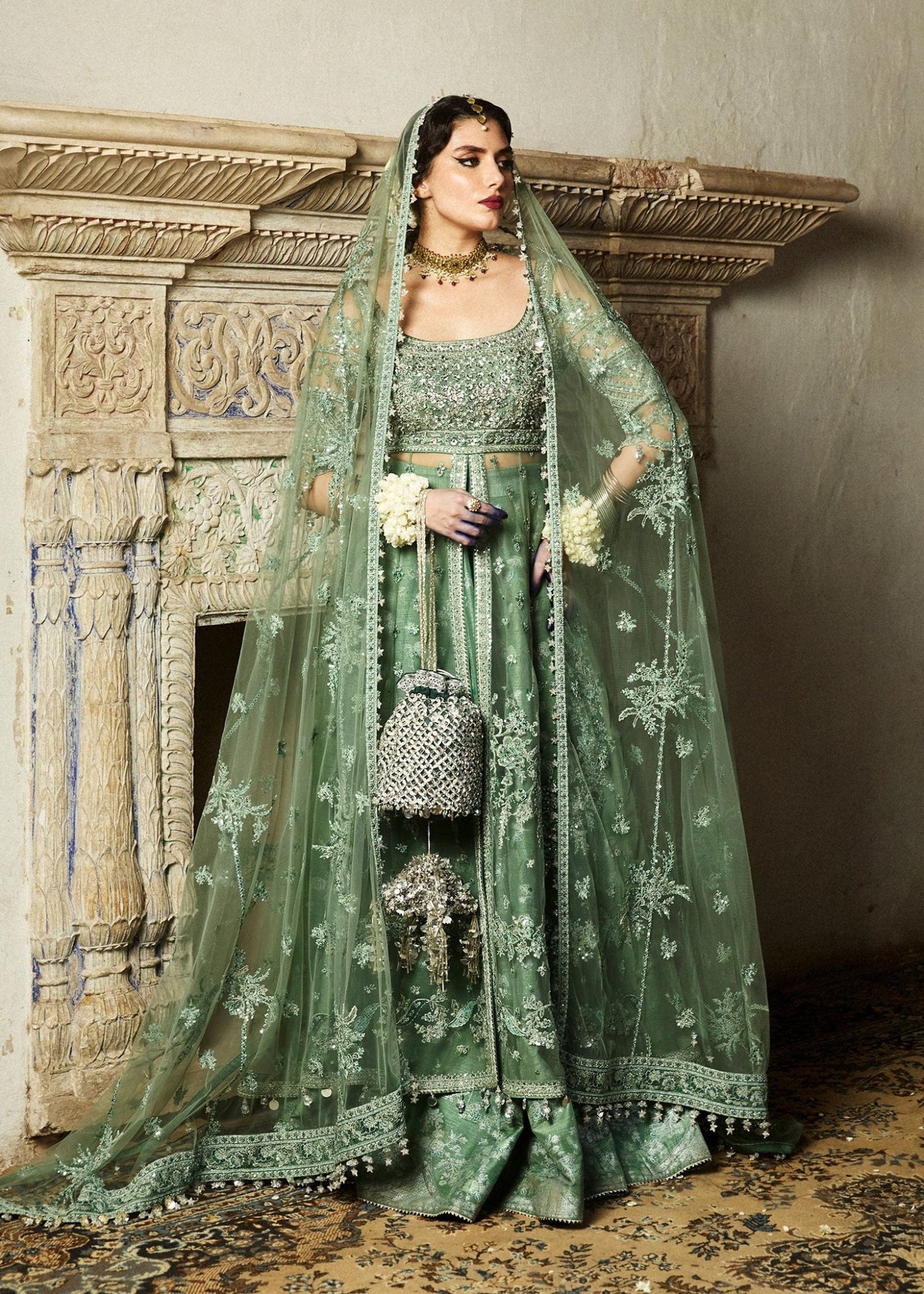 Model wearing a sage green Parag dress from Hussain Rehar's Wedding Festive Sep '24 Collection, featuring intricate embellishments. Pakistani wedding clothes available online in the UK.