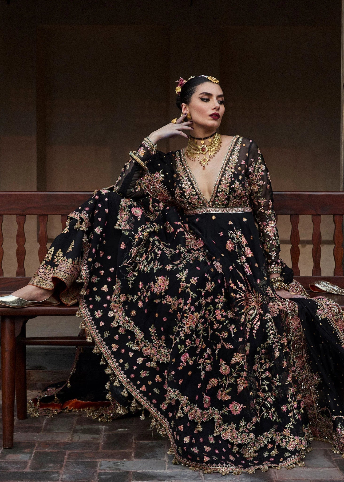 Model wearing a black Pathaar dress from Hussain Rehar's Wedding Festive Sep '24 Collection, featuring intricate floral embroidery. Pakistani wedding clothes available online in the UK.