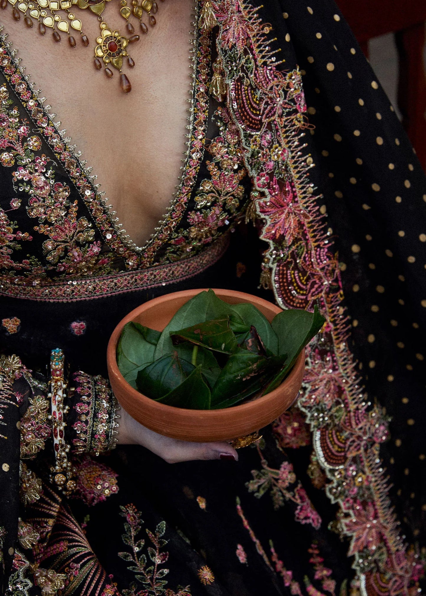 Model wearing a black Pathaar dress from Hussain Rehar's Wedding Festive Sep '24 Collection, featuring intricate floral embroidery. Pakistani wedding clothes available online in the UK.