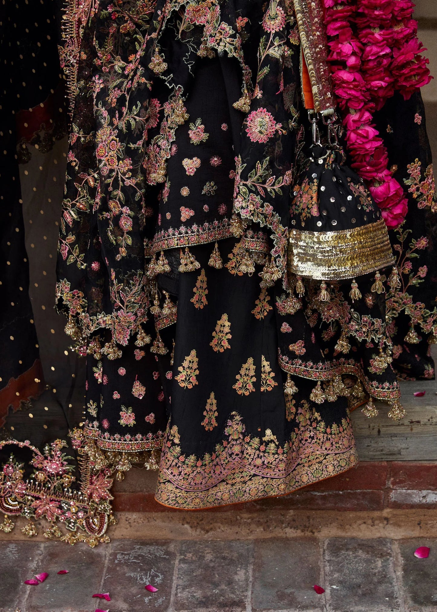 Model wearing a black Pathaar dress from Hussain Rehar's Wedding Festive Sep '24 Collection, featuring intricate floral embroidery. Pakistani wedding clothes available online in the UK.