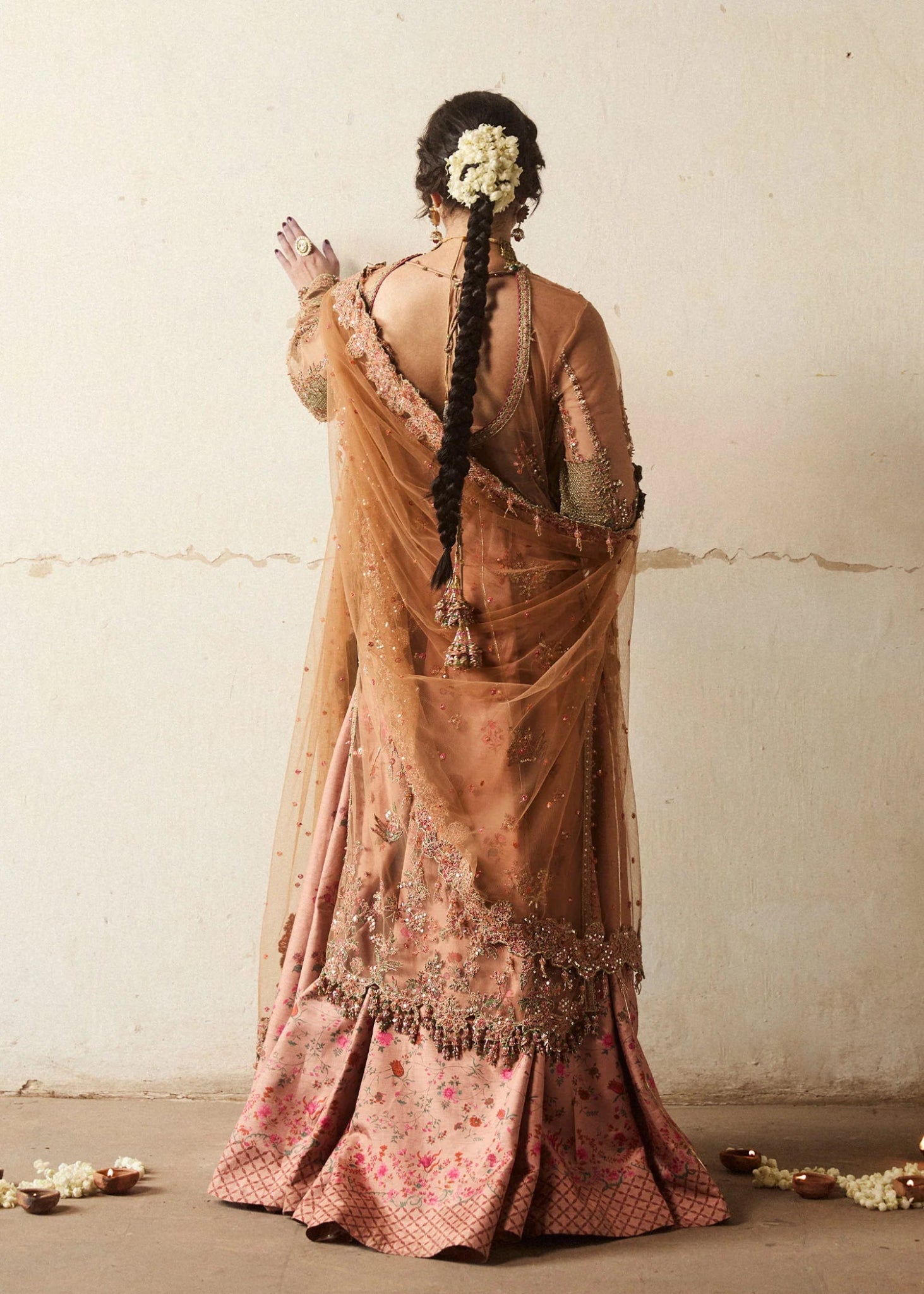 Model wearing a bronze Raitla dress from Hussain Rehar's Wedding Festive Sep '24 Collection, featuring floral embroidery and embellished details. Pakistani wedding clothes available online in the UK.