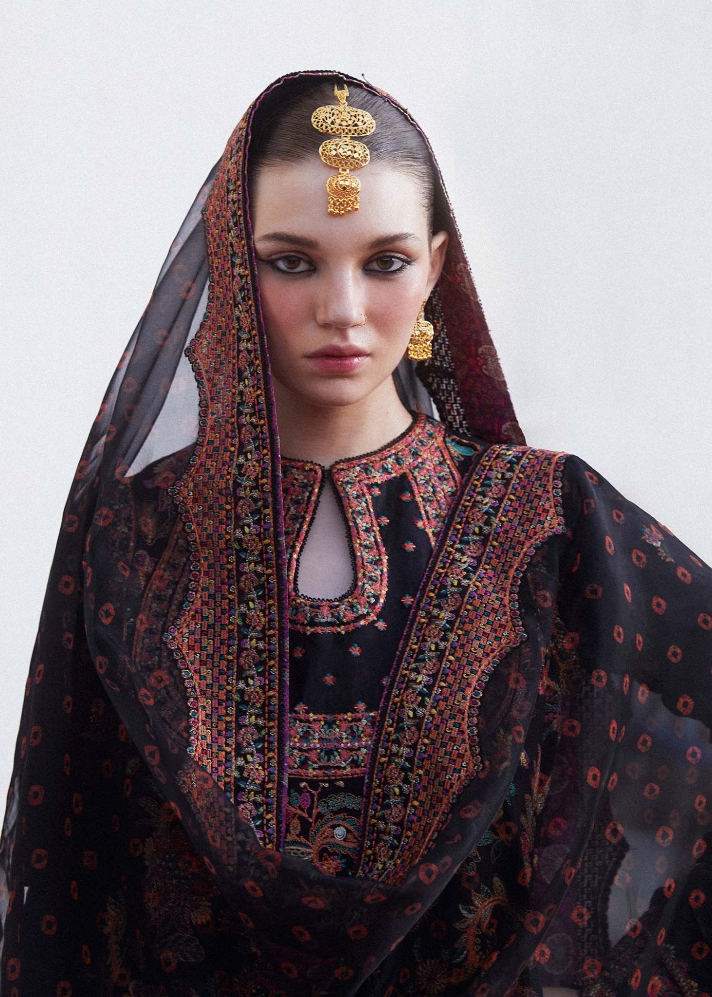 Model wearing black Siyaan dress from Hussain Rehar's Zaiba Lawn '24 collection. Pakistani clothes online in UK. Beautiful floral embroidery.