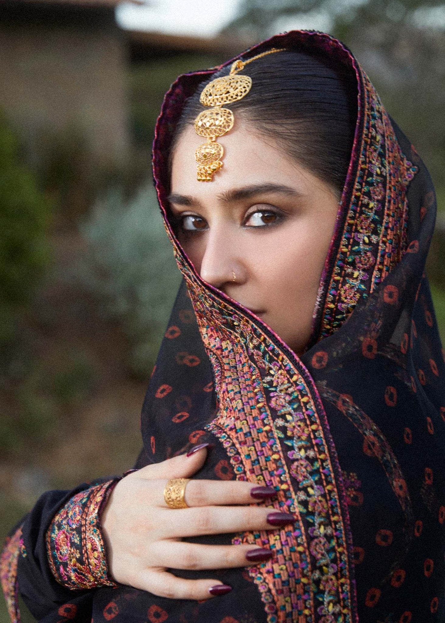 Model wearing black Siyaan dress from Hussain Rehar's Zaiba Lawn '24 collection. Pakistani clothes online in UK. Beautiful floral embroidery.