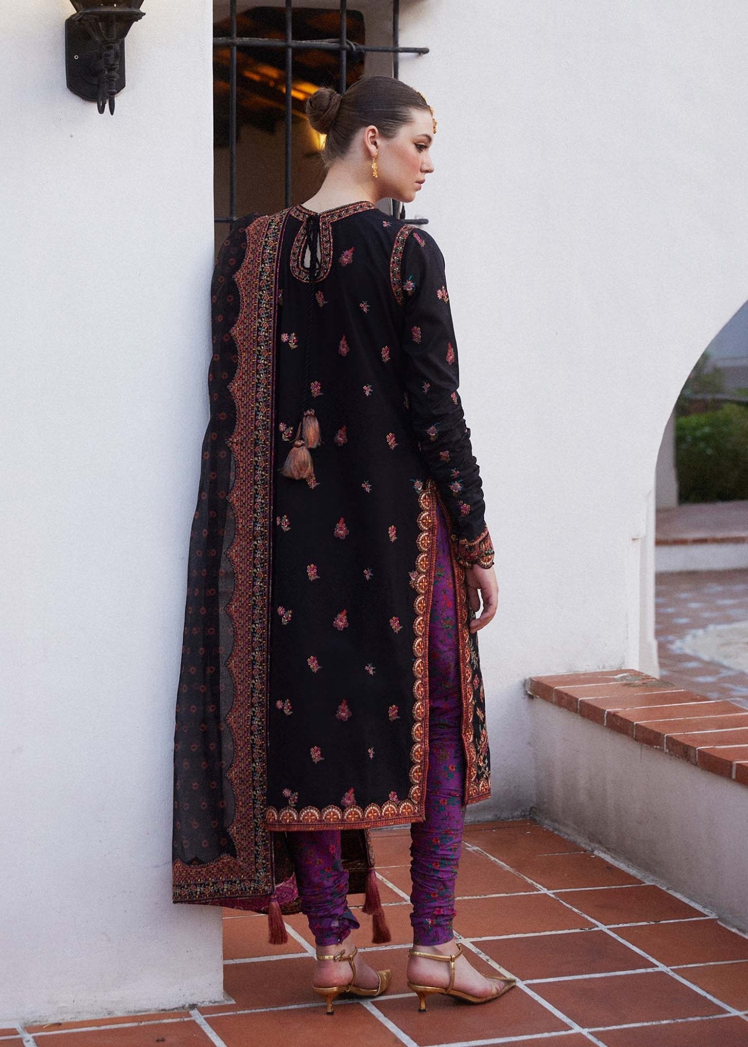 Model wearing black Siyaan dress from Hussain Rehar's Zaiba Lawn '24 collection. Pakistani clothes online in UK. Beautiful floral embroidery.