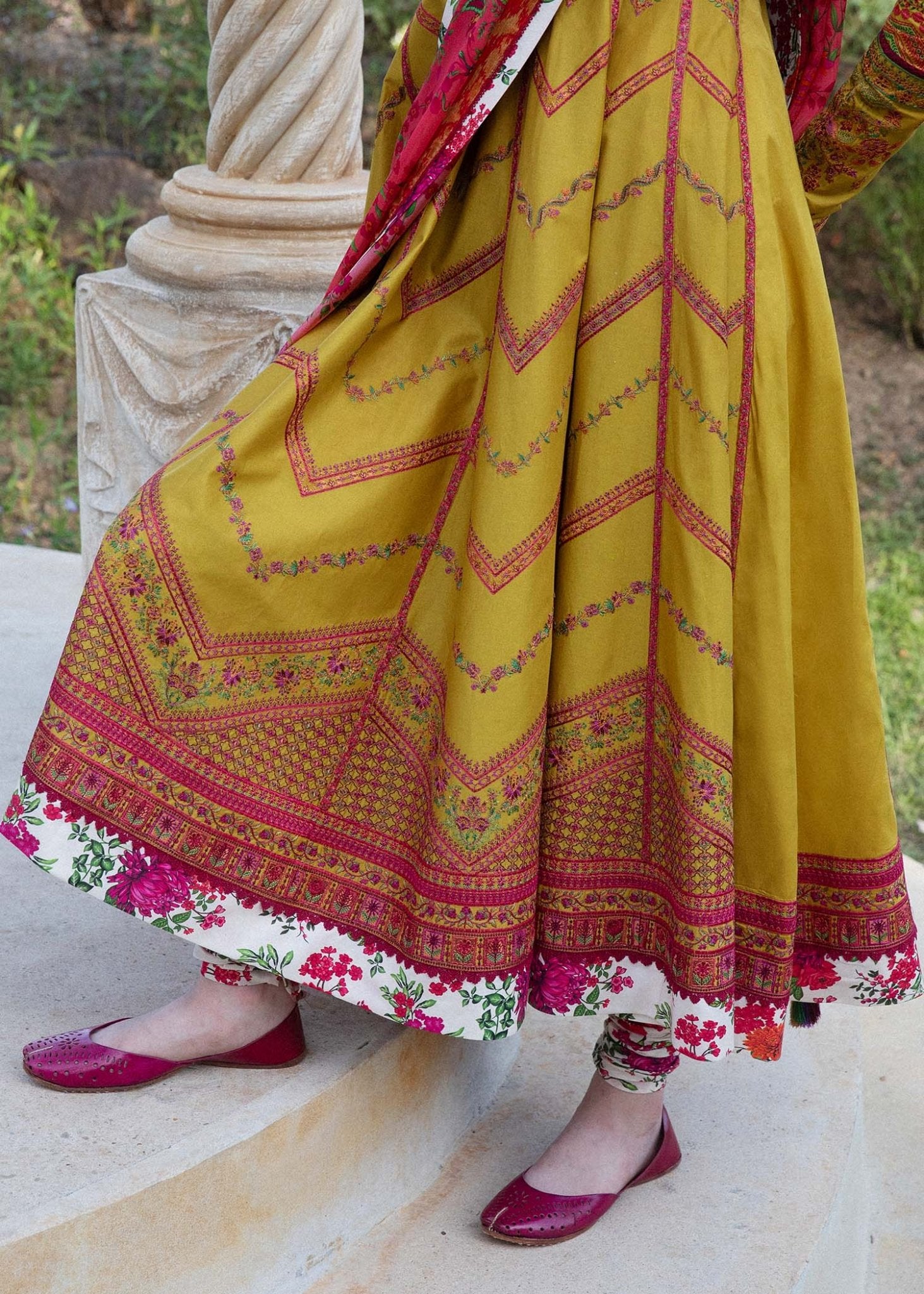 Model wearing a yellow Sunehri dress from Hussain Rehar's Zaiba Lawn '24 collection. Pakistani clothes online in UK. Vibrant floral patterns.