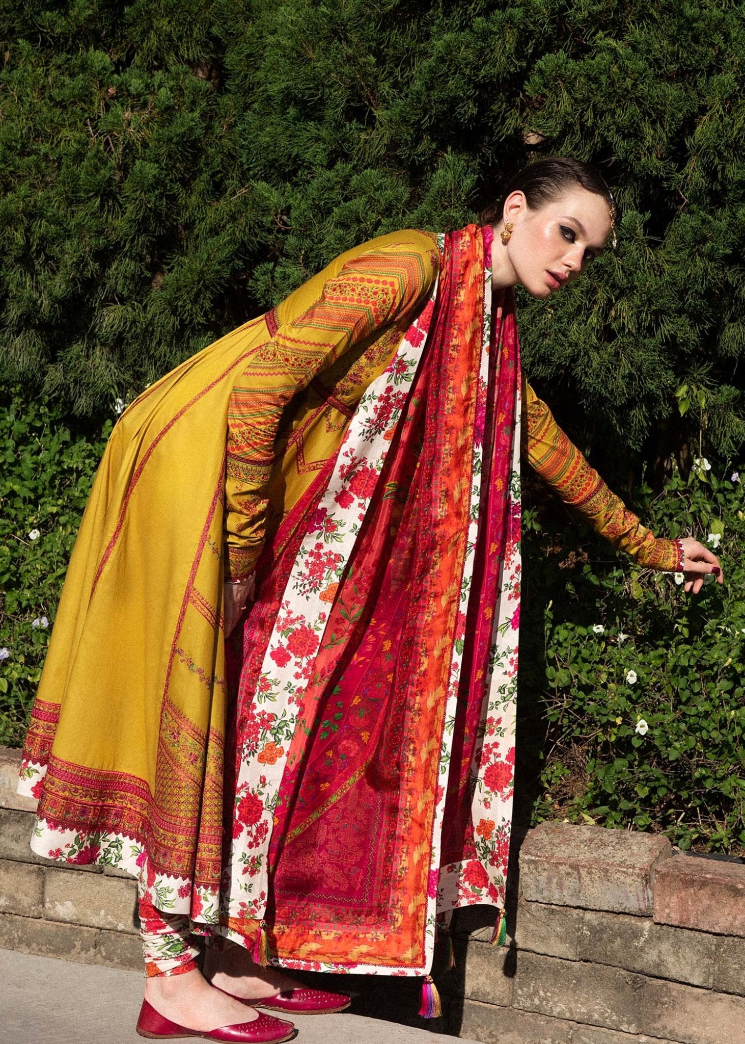 Model wearing a yellow Sunehri dress from Hussain Rehar's Zaiba Lawn '24 collection. Pakistani clothes online in UK. Vibrant floral patterns.