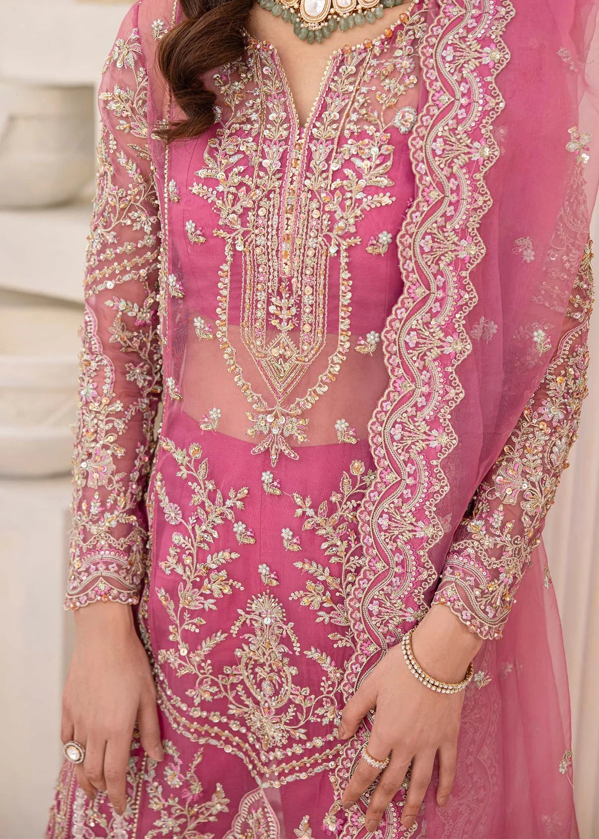 Model wearing pink Risha outfit from Kanwal Malik featuring heavy embroidery—Pakistani luxury pret available online in UK.