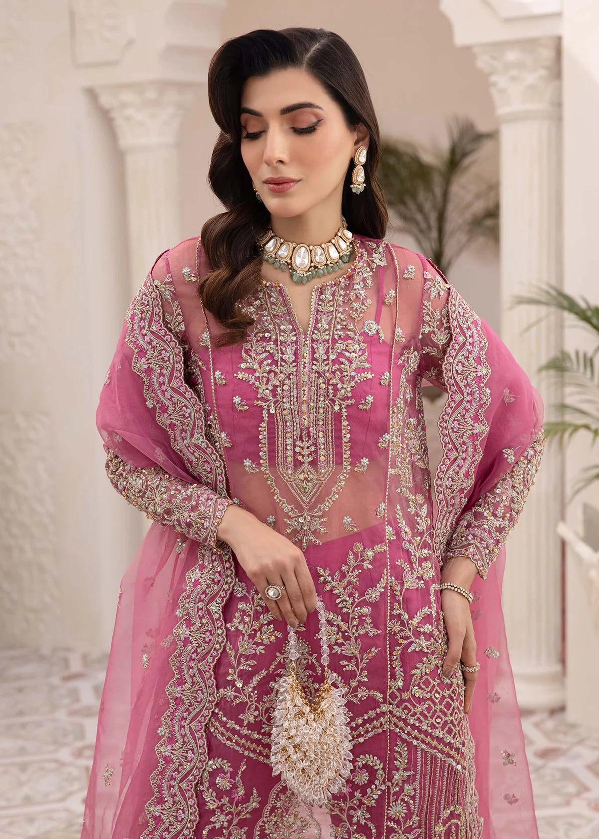 Model wearing pink Risha outfit from Kanwal Malik featuring heavy embroidery—Pakistani luxury pret available online in UK.