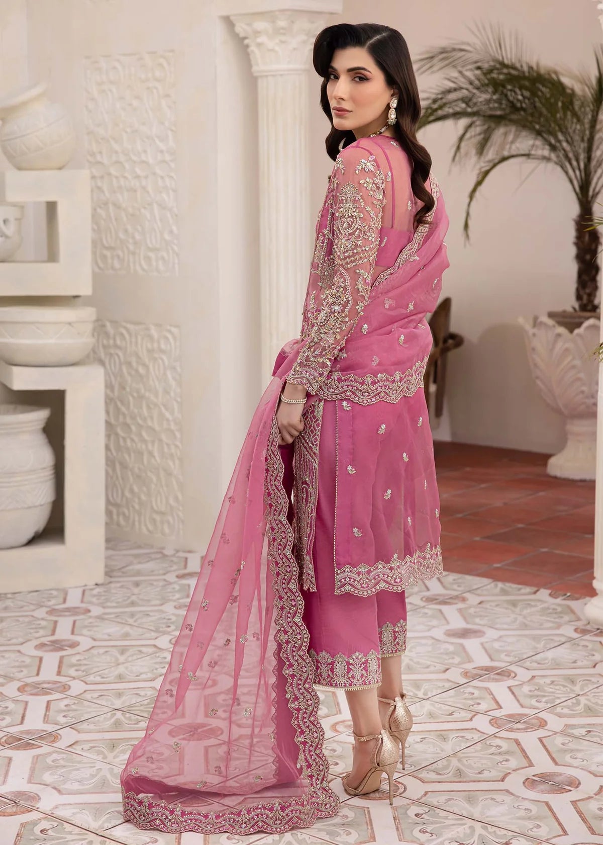 Model wearing pink Risha outfit from Kanwal Malik featuring heavy embroidery—Pakistani luxury pret available online in UK.