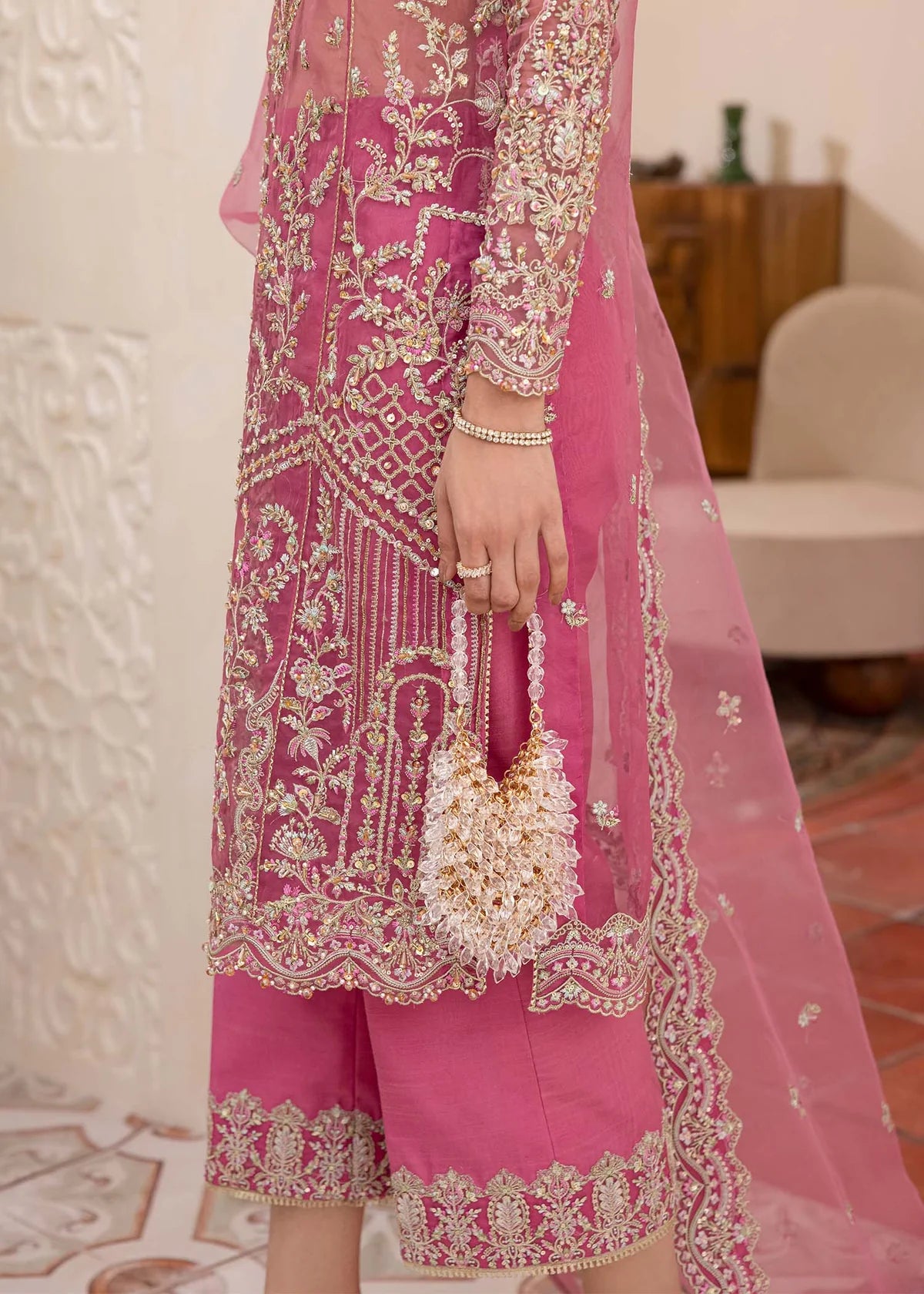 Model wearing pink Risha outfit from Kanwal Malik featuring heavy embroidery—Pakistani luxury pret available online in UK.