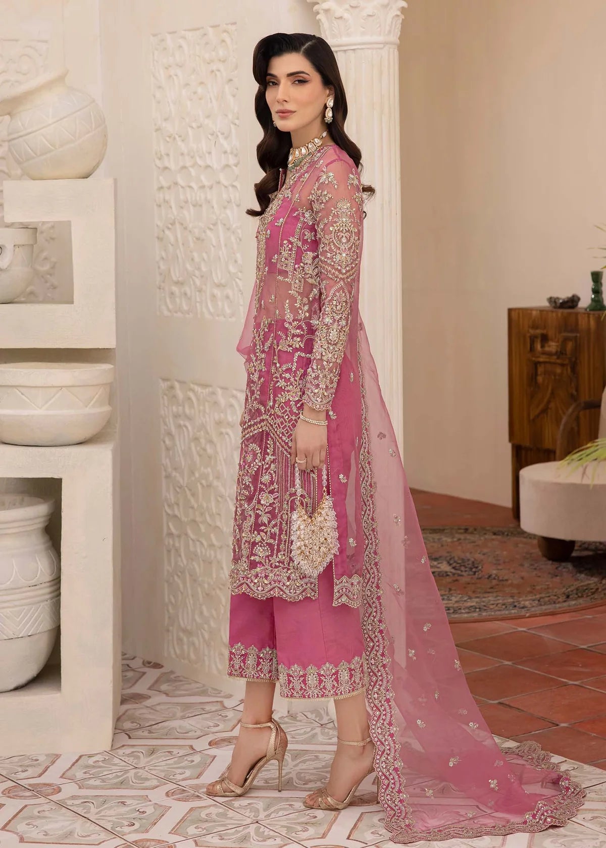 Model wearing pink Risha outfit from Kanwal Malik featuring heavy embroidery—Pakistani luxury pret available online in UK.