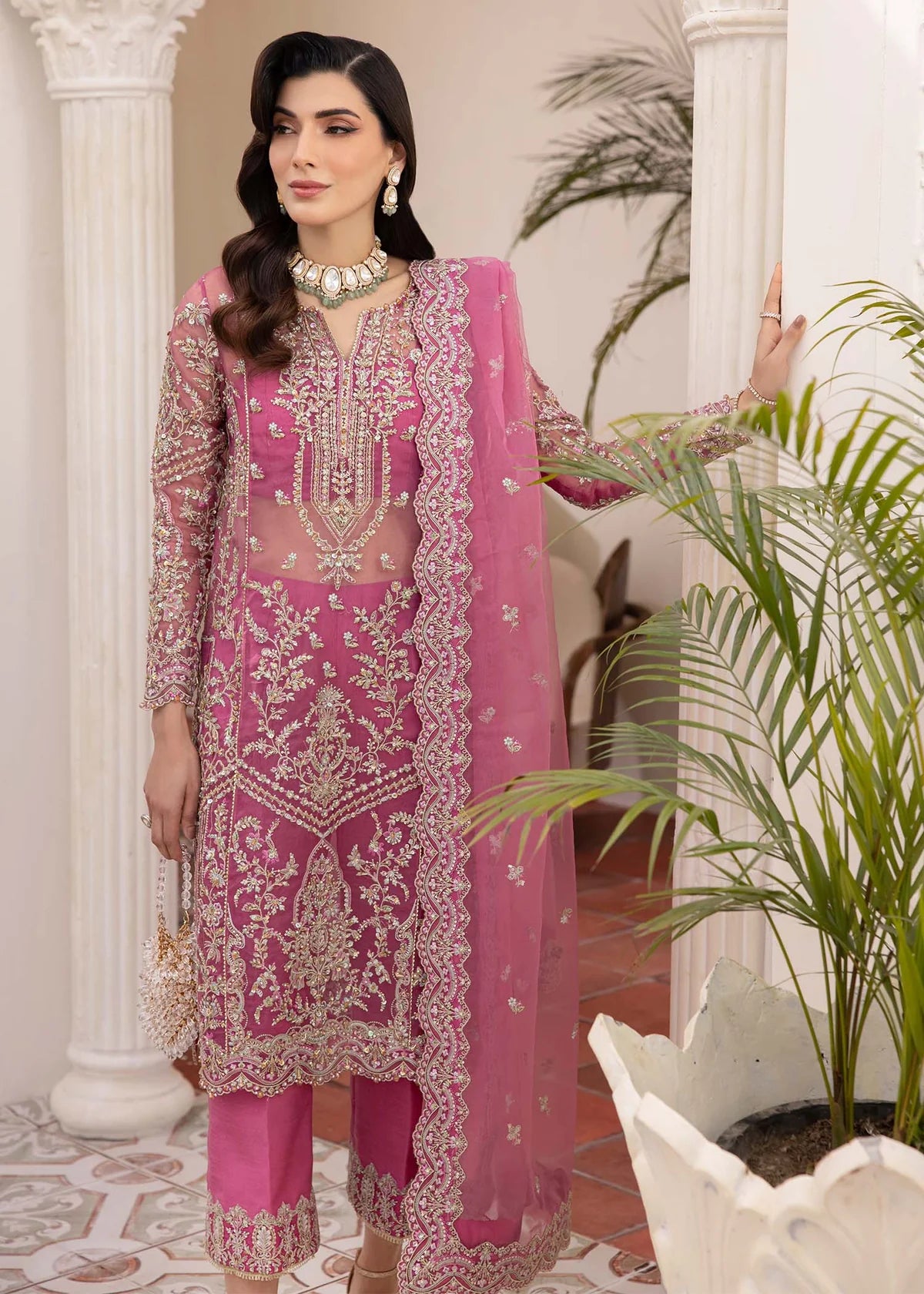 Model wearing pink Risha outfit from Kanwal Malik featuring heavy embroidery—Pakistani luxury pret available online in UK.