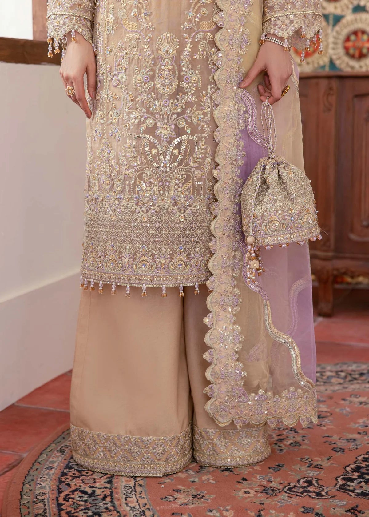 Model wearing beige and lilac Mahin outfit from Kanwal Malik—Pakistani luxury pret perfect for festive wear, shop online in UK now.