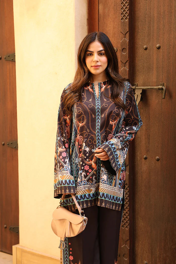 Model wearing black co-ord set with multicolour floral and geometric print from Saira Rizwan, Pakistani Luxury pret, Pakistani clothes online in UK.