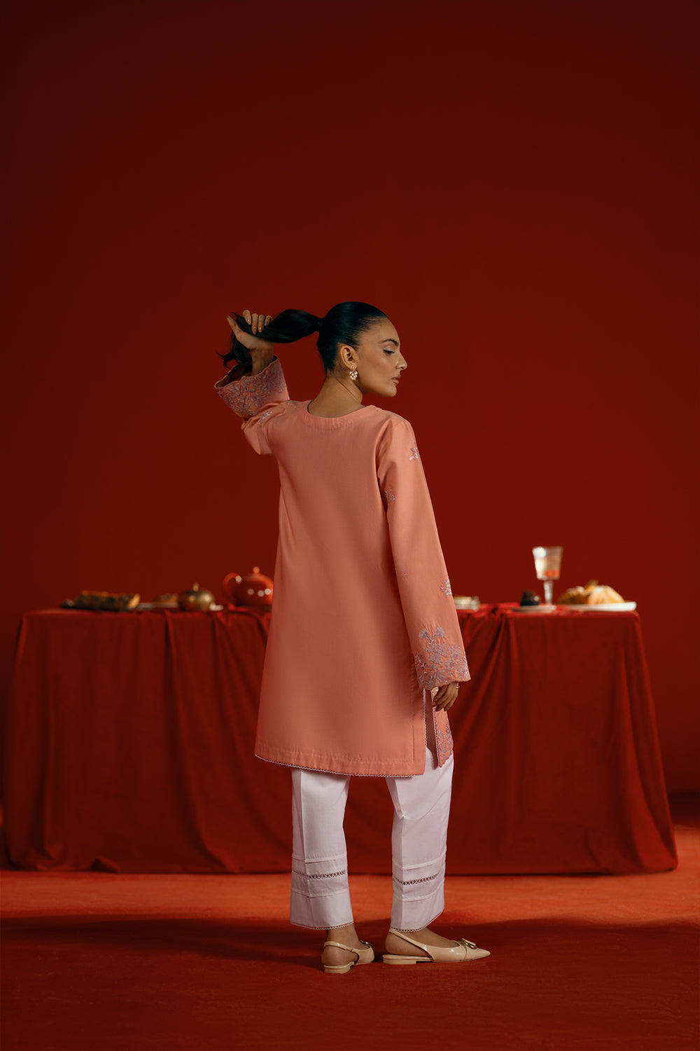 Model wearing peach embroidered outfit from Saira Rizwan Joolie | PEACH - JBP25-05, elegant Pakistani luxury pret available online in UK.