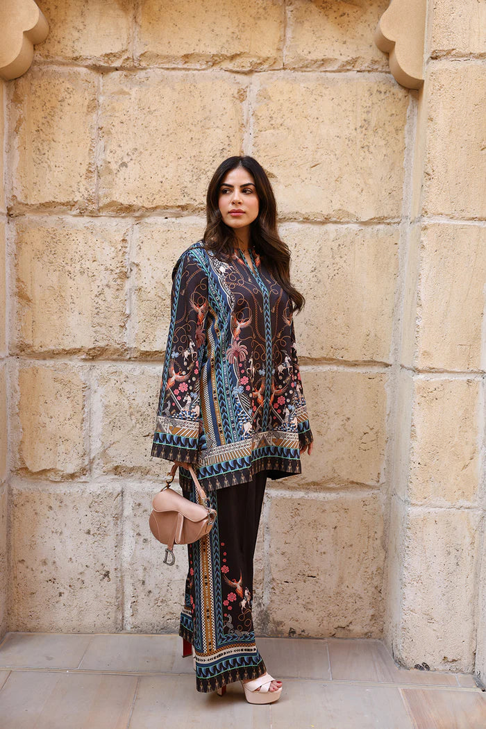 Model wearing black co-ord set with multicolour floral and geometric print from Saira Rizwan, Pakistani Luxury pret, Pakistani clothes online in UK.