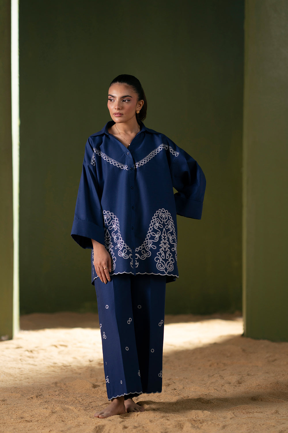 Model wearing navy blue embroidered outfit from Saira Rizwan Joolie | BLUE-JBP25-03, Pakistani luxury pret available online in UK.